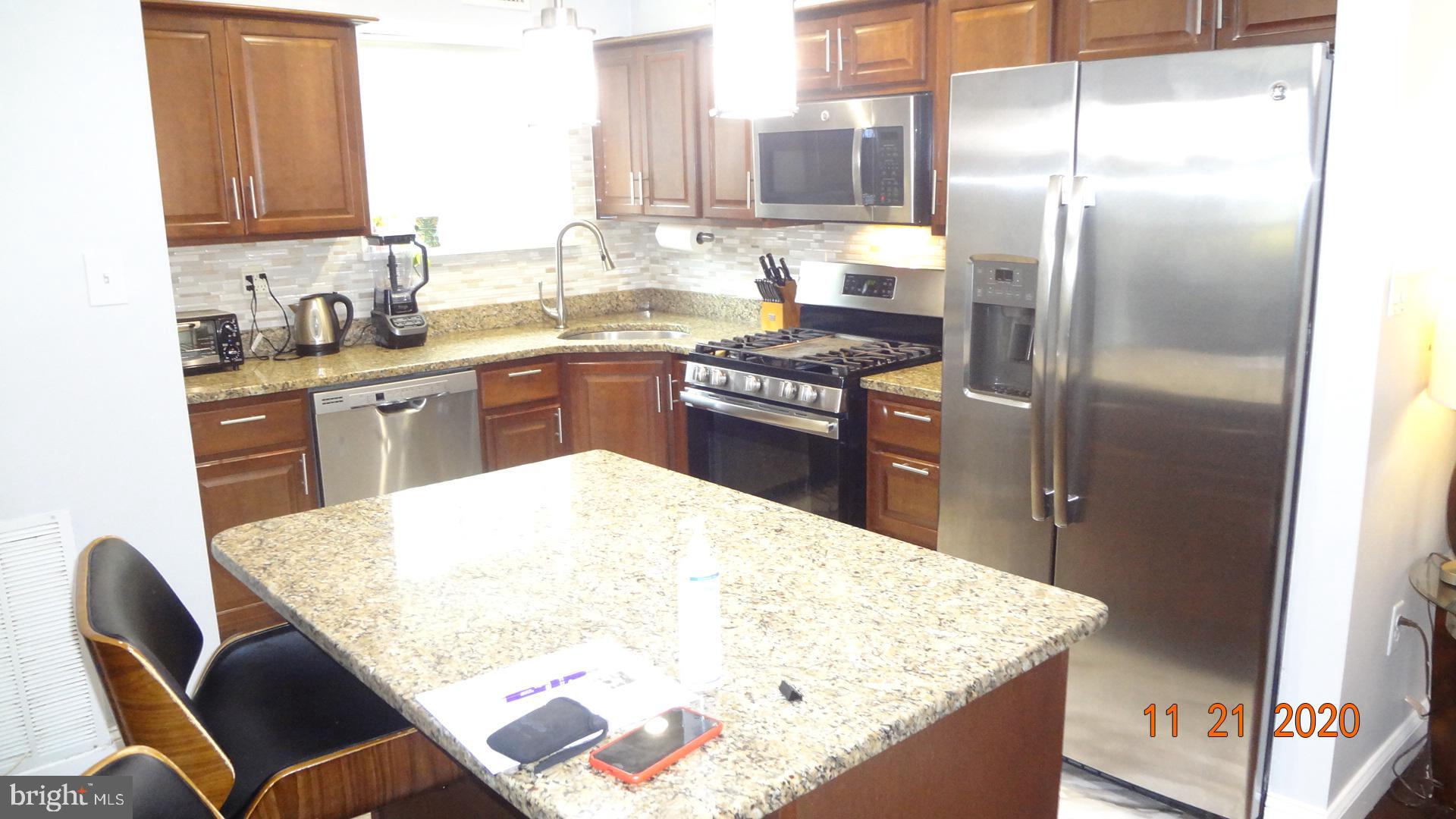 Total Gem!! Remodeled kitchen with island, remodeled bathrooms, hardwood floors, freshly painted, bright and nice, Condo fee covers all utilities, NOT FHA approved, assigned parking