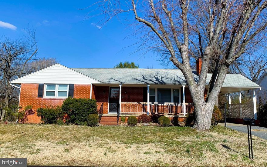 Charming and spacious Rambler w/basement just minutes from downtown Fredericksburg! This all-brick home with a country style front porch, has an attached carport and a gorgeous sunroom around back. From the carport is a 2nd entry into the country-style kitchen or to stairs leading down to the huge unfinished, but useable walk-out basement. Home features 3 spacious bedrooms, each with ample closet space, 2 linen closets and hardwood floors throughout. LR with wood burning fireplace and a formal separate DR featuring a unique pocket door to close off kitchen if desired. From either the DR or kitchen you'll have access to the sunroom, laundry room with W&D ("as-is") and backyard. Pick up where the previous owner's left off, with the gardens and landscaping throughout the property! Home is on a quiet street and is vacant and ready for immediate occupancy.