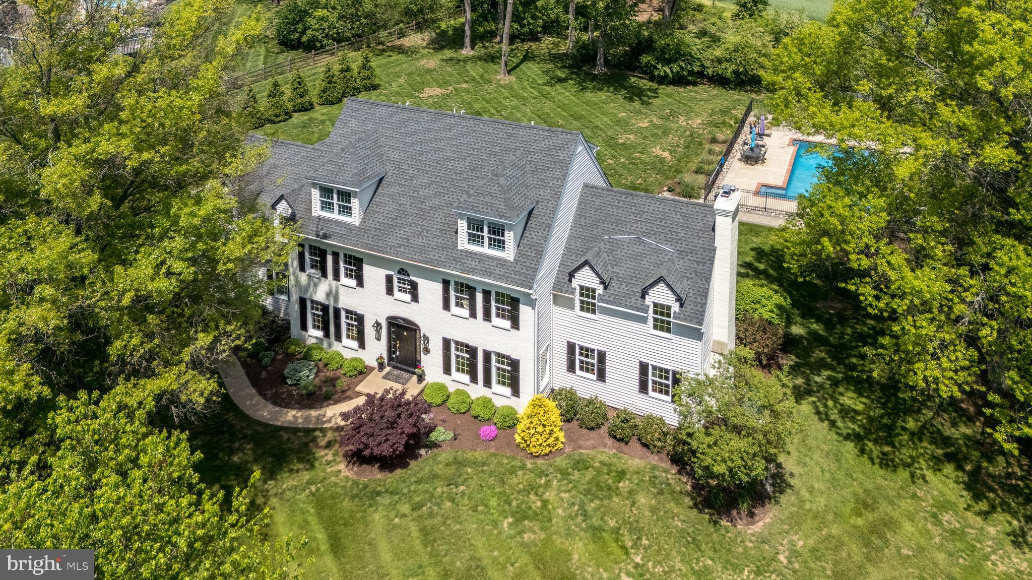 Welcome to Fox Hunt Estates at 4976 Gloucester Drive, Doylestown, PA, an elegant 5,500+/- square foot home boasting 7+ bedrooms and 5.5 baths with a recent addition of a main floor In-Law suite. This residence perfectly balances sophistication with comfort, featuring hardwood floors throughout the first floor, a spacious family room, inviting living room, and formal dining room with a huge updated entertaining kitchen. The back wall of full windows & doors in the Family Room and Kitchen bring the outdoors inside.
The second-floor primary en-suite offers a private retreat, complemented by additional bedrooms, the laundry room , office and hall bath, including multiple bedrooms and two full bathrooms on the third floor.
The newly added au pair or in-law suite on the main level includes a bedroom, full bath/laundry, kitchenette/family room with a private entrance, enhancing the home’s versatility. The finished lower-level basement provides ample space for recreation and hobbies, along with essential storage areas.
The recently updated deck and bluestone hardscaped terrace leads to a beautiful pool and expansive yard, creating a perfect outdoor haven. The back of this property adjoins to a preserved farmland. The sellers have enjoyed the mini woods for their bonfires - it could be cleared for a direct open view to the preserved land.
Enjoy the updated amenities(there is a list of multiple upgrades available) of this luxurious lifestyle with its prime location and exceptional features.