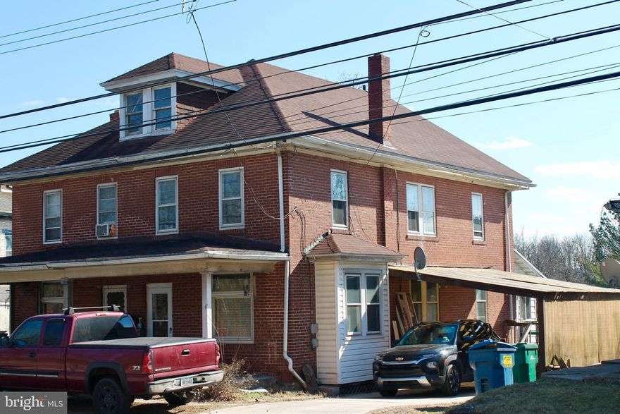 Welcome to 320 E Baumstown Rd! This 3 Bedroom 1 Bathroom  is a brick semi detached home  in Exeter Township. Full Staircase leads to a finished attic that has updated wiring throughout. The second floor has a full bath along with 3 bedrooms. The first floor has a mudroom leading into a large eat in kitchen, followed by a formal dining room with the original French doors and all the original woodwork. The dining room opens up into the living room . Downstairs  is a full basement with natural gas heat,  hot water, 100 amp panel, and a walk in shower. Outside is a great open back yard, and attached to the house is a carport. Water heater, well pump, bladder tank, and pressure switch all replaced in the past two years. House is being sold "As is"