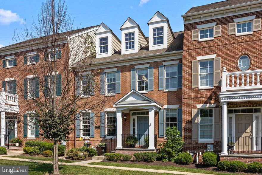 This elegant home is nestled on a tranquil premium lot, offering serene views of picturesque farmland. Located just a short walk from the heart of  Newtown Borough, you'll have easy access to shopping, dining, and all the conveniences of town life.  The home features three levels of well-designed living space with an open floor plan ideal for entertaining and hosting large family gatherings.  There is beautiful wood flooring on the first level and impressive architectural details  found throughout, with custom millwork, cabinetry, and stone accents.  The bright and spacious living room flows seamlessly into the dining area, beautifully defined by custom stone columns. The gourmet kitchen boasts upgraded cabinetry, granite countertops, a center island with pendant lighting and seating, a cozy dining area, and direct access to a private deck and a two-car garage.  The adjoining great room is bathed in natural light from a wall of windows, while a striking floor to ceiling stacked stone fireplace, framed by custom built-ins, serves as the room’s focal point.  On the second level, the expansive master suite features two walk-in closets and a luxurious en suite bath with dual vanities, a large soaking tub, and a custom-tiled shower. Two additional spacious bedrooms, a full hall bath, and a conveniently located laundry room complete this floor. The third-level loft provides versatile space that can be used as a fourth bedroom, office, exercise room, or craft room, and is plumbed for an additional bathroom, allowing for further customization.   A full, unfinished basement with a high ceiling is ready for your finishing touches.  Newtown Walk has recently received the "Gold Star Community Award"  designation that recognizes communities that work hard to develop and maintain standards, encourage community participation, maintain fiscal stability and positively impact the quality of life for its residents.   Enjoy the best of Newtown Borough living with top-rated Council Rock Schools and easy access to local amenities, all within walking distance. 
Note:  there is a gas line on the deck ready for your  grill connection.