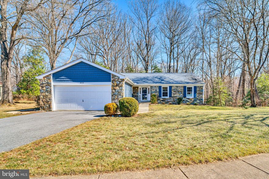 Professional photos to be posted 2/25.   This exceptionally updated rancher with finished basement is nestled in the highly sought-after 55+ community of Heritage Harbour.  Situated in a quiet cul-de-sac on a premium lot backing to mature trees, this home offers both privacy and serene wooded views.  Thoughtfully designed for comfort and convenience, it boasts numerous updates and improvements, ensuring a move-in-ready experience.  The spacious main level features an inviting layout featuring an open concept floor plan, with living room boasting a wood-burning fireplace with decorative mantel surround, overlooking the backyard wooded landscape.  The dining room sits adjacent to the living area, creating a warm and inviting space for meals and gatherings.   The remodeled kitchen features a unique circular island, with built-in shelves and wine storage, that serves as both a stunning focal point and a functional gathering space.  Thoughtfully designed, with high-end finishes, custom cabinetry, and premium countertops, the kitchen seamlessly blends style and practicality.  Modern stainless appliances, ample storage, and elegant lighting complete the space, making it perfect for cooking, entertaining, and everyday living.  There’s also a convenient laundry closet with custom shelving.  A bright and inviting office/den serves as the perfect space for work, reading, or hobbies, with atrium doors that lead directly to a brand-new composite, 536 sq. ft. wraparound deck, seamlessly blending indoor and outdoor living.  The deck leads to an exceptionally large screened in porch with finished ceiling and ceiling fan.  Spending time here is like being in your own personal tree house.  Whether enjoying a morning coffee or entertaining guests, this expansive deck and screened in porch provide a private retreat surrounded by nature.  The owner’s suite is perfectly situated at the back of the home, also offering serene views of the woods for ultimate privacy and relaxation and direct access to the screened in porch right off of the bedroom. This retreat also includes an en-suite bath with a walk-in shower and vanity with illuminated mirror and modern lighting.  A spacious walk-in closet completes the suite.  Two other bedrooms (one used as a den), along with remodeled hall bath featuring a tub/shower combo with shelf and a vanity.  The finished basement provides additional versatile living space, perfect for recreation room, hobbies and/or guest accommodations, and loads of natural light is offered by new sliding glass doors to the backyard.  Heritage Harbour is a vibrant community offering a lifestyle of leisure and recreation, including a golf-tennis court-clubhouse complex, indoor and outdoor pools, walking trails, tennis courts, and walkways to the waterfront access including pier with boat slips and kayak/canoe storage and sandy beach for launch. The lodge is a focal point for gatherings and events, and includes an auditorium with dance floor, conference room, billiards room, and much more! Easy access to Rts. 50 and 97, Annapolis Town Center and Westfield Mall!