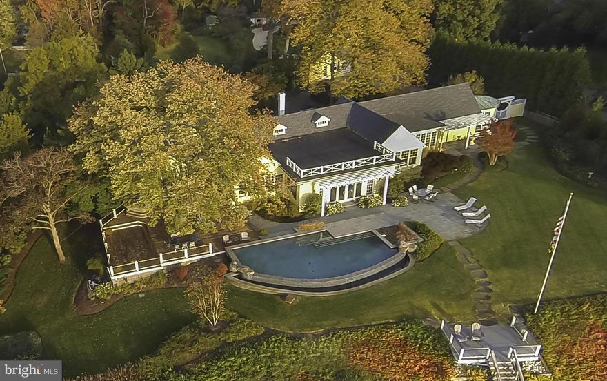 Elegant waterfront residence w/ wide views &  310 ft  on the South River, private pier, infinity pool & spacious mahogany deck w/ outdoor kitchen, perfect for entertaining! Built by Marshall Field as a summer cottage,updated for casual,understated, elegant living. Updated kitchen, master suite and 3 add'l BRs. One level living! Wine cellar, 2 car garage w/private office.