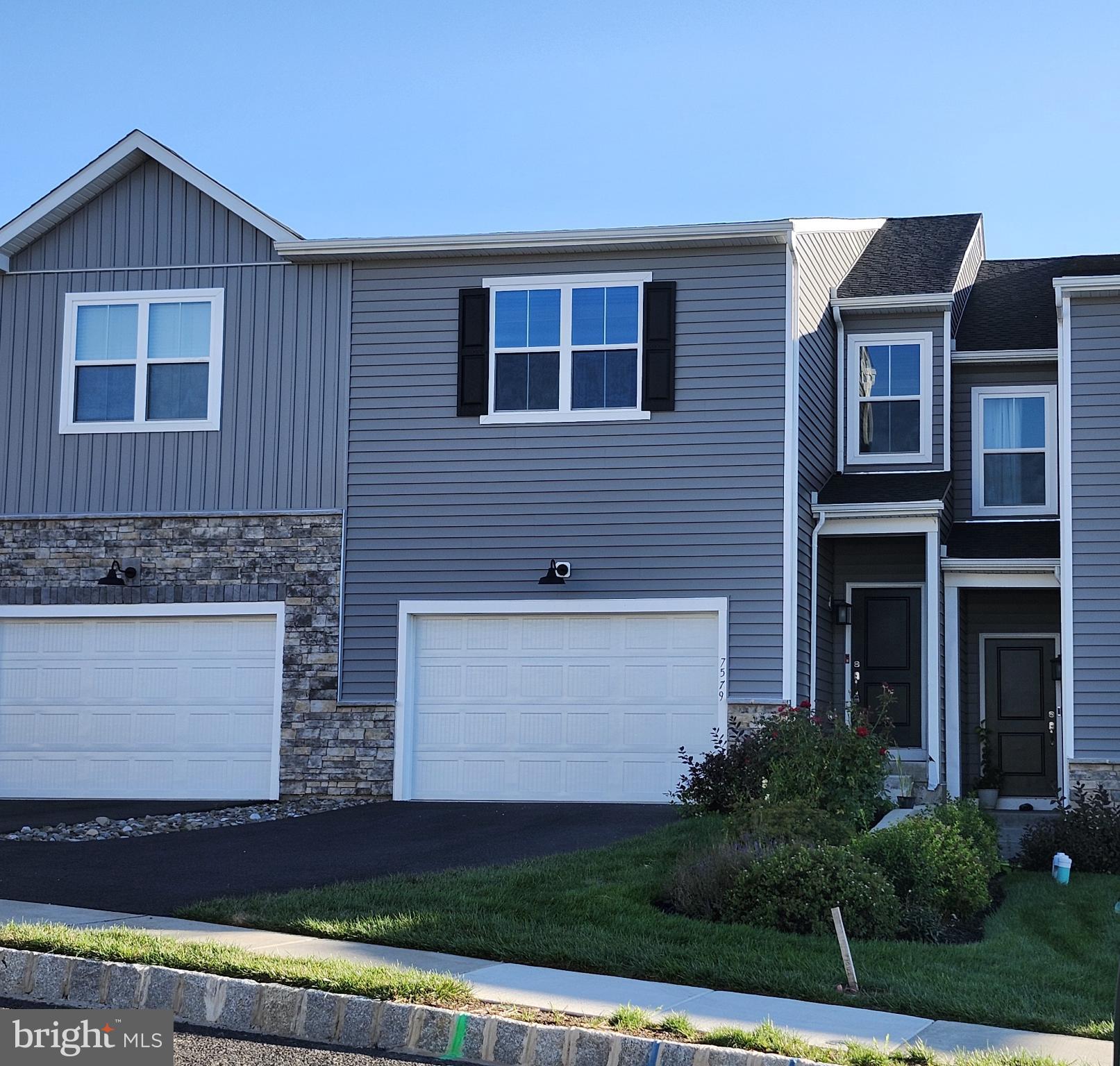 This nearly new Brynley model townhome, built in 2022, offers the perfect blend of comfort, style, and convenience in the desirable Brookside Court at Upper Saucon community, within the Southern Lehigh School District. Featuring 3 bedrooms and 2.5 baths, this smart home showcases a bright open floor plan with a modern kitchen accented by quartz countertops and stainless steel appliances. The kitchen flows seamlessly into the dining and living areas, creating an inviting space for both everyday living and entertaining. Upstairs, the spacious primary suite includes a large walk-in closet and a private bath with stylish tile finishes, while the additional bedrooms also feature walk-in closets for generous storage. A central loft and a convenient laundry room with washer and dryer complete the second floor. Outdoor living is enhanced by a maintenance-free Trex deck, and the 1.5-car garage plus full daylight basement provide plenty of storage. With 9-foot ceilings, the basement also offers flexible space for fitness or hobbies. Ideally located near major highways, shopping, dining, and parks, this home combines modern amenities with a low-maintenance lifestyle in a highly sought-after setting.