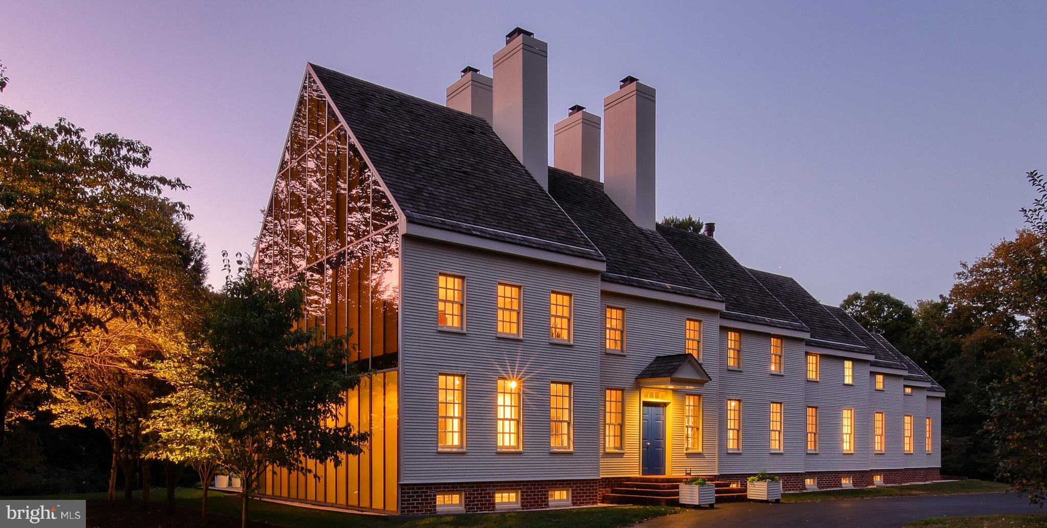 This beautiful unique home, featured in over 20 international publications, including Architectural Digest; was designed & furnished in 1980 and recently updated in 2010 by world-renowned Washington D.C. architect Hugh Newell Jacobsen. Strategically positioned on the 2.7 acre lot, the park-like drive leading to the home s circular driveway allows for viewing the home at all angles, and taking in the architects ability to blend modern architecture with a traditional German farmhouse. The front facade with its Telescope design, cedar clapboard siding, brick foundation and raised panel front door draws you into the traditional feel of this home, but that s where the style of the home flows into the modern era, with its steel framed angular glass on the exposed sides and rear of the home. Once inside, natural light floods into the home at all angles from the numerous skylights, sliding glass doors and three-story south-facing glass wall, truly a departure from a traditional colonial-style residence.This 4 bedroom & 4 full and 3 ( ) bath home has over 5,000 square feet above grade on 3 levels with an additional 900+ sq.ft finished Game-room on the lower level. The 3-story open foyer is accented by Pennsylvania bluestone floors and an exquisite view of the rear patio and fountain with floating steps.The spacious formal living room has 2 walls of windows bringing the outside in and highlights a mature grove of dogwood and the back patio and landscape. The home features a formal dining room with a soaring vaulted ceiling, custom designed built-in buffets and open mirrored curio shelving.One cannot overlook the modern top of the line appliances, ample cabinetry and countertops in the bright kitchen, including a center island with JennAir cooktop and grill, two deep pantries, Sub-Zero side-by-side, double convection ovens & warming drawer. The kitchen, dining room and living room all feature 8 sliding glass doors that open to a 2-level Pennsylvania flagstone patio and fountain. The patio extends along the entire rear of the home, perfect for indoor/outdoor living and entertaining.The library is a few steps away from the kitchen, and has a wall of trademark Jacobsen egg crate style bookshelves with built-in file drawers, retractable screen and video/projector cabinet. The open riser circular staircase provides visual interest and access to all levels of the house. The second-floor Master Suite is complete with plush wool carpeting, architectural designed bedside tables and reading lamps, surround sound Klipsch speakers, master dressing area with ample built-ins, closets and storage and a sitting-room with views to the garden and dogwood grove. Central to the design of the Master Bath is the double oversized custom shower, floating vanities and a free-standing soaking tub, all featuring Dornbracht fixtures. The second bedroom is an en-suite (as are all the bedrooms), its streamlined built-in desk area and bedside tables add to the overall charm of the home. A full-sized walk-in cedar closet, small secret reading room and attic storage can be accessed from this bedroom. The third level is adorned by a vaulted ceiling, skylights and a wall of windows. Privacy for the sleeping end of this room was created with a custom built-in divider and with the walk-in closets and drawers at both ends of this space, make this an ideal bedroom and/or office. Other areas & features of this modern day masterpiece include the oversized mudroom, 4th bedroom (again the presence of trademark bookshelves with sewing table & seating machine, ironing board, private bath), plentiful pocket doors & closets galore. Hidden upstairs storage area 25' x 16'. 1ST floor laundry room with outside basement entrance through oversized barn doors make this area possible as an add'l garage space. Nice car garage area of 26' x 25'. The secret zen garden complete with waterfall pond and natural woodland paths create that perfect outdoor haven.
