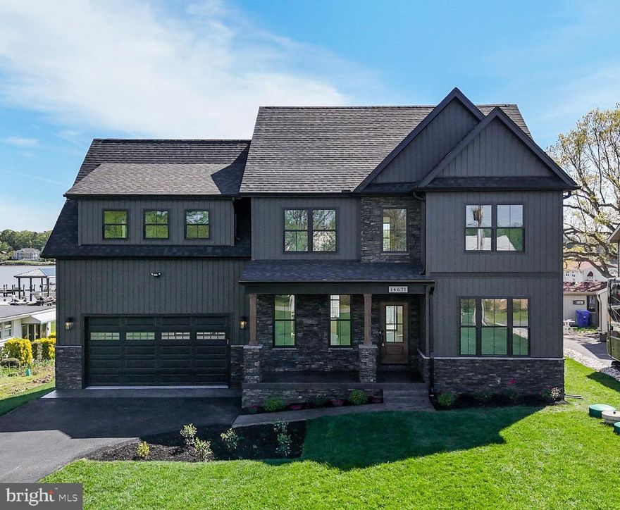 Introducing an exquisite, newly constructed waterfront retreat! This home embodies luxury and modern design. Nestled on the serene shores of the "protected" body of water known as Cuckold Creek which leads into the Potomac River, this home offers breathtaking views. Adorned with modern finishes on the exterior such as black Anderson windows, black siding, dark stone and walnut accents to the interior with beautiful light maple flooring throughout and black and gold accents. The expansive windows and sliding back door flood the interior with natural light. The gourmet eat-in kitchen is equipped with quartz countertops, glass-tile backsplash, gas range, walnut range hood, double wall ovens, custom cabinetry and coffee/beverage bar. There is also a separate office and dining room on the main level. On the upper level you will find the primary suite with an en-suite bathroom featuring a fully tiled shower, dual vanity sink, freestanding  soaking tub and a generous walk-in closet. The upper level laundry room is conveniently located with access from the primary bath and hallway. Two additional bedrooms share a full bath and the fourth bedroom is not only spacious but has an en-suite full bath as well. The meticulously landscaped exterior includes, stamped concrete walkways and covered front porch, a fully sodded lawn and a sprawling new deck perfect for entertaining or unwinding and taking in the beautiful sunsets. Enjoy fishing or boating from the new private pier with electric hookup in place and ready for a boat lift. Shoreline has 75 ft of water frontage, deep water and a bulkhead. There is a convenient community ramp close by available to residents of Banks O'Dee if you or your guests need to use it to launch or remove your boat from the water. The climate controlled crawlspace has a concrete slab which can be used for storage. A full house generator provides comfort and peace of mind year round. The community has no restrictive covenants. The home sits above and beyond the flood zone; therefore, flood insurance is not required. Just a quick boat ride to several restaurants on the water in Colonial Beach or Cobb Island. Embrace the convenience and pleasures of waterfront living!