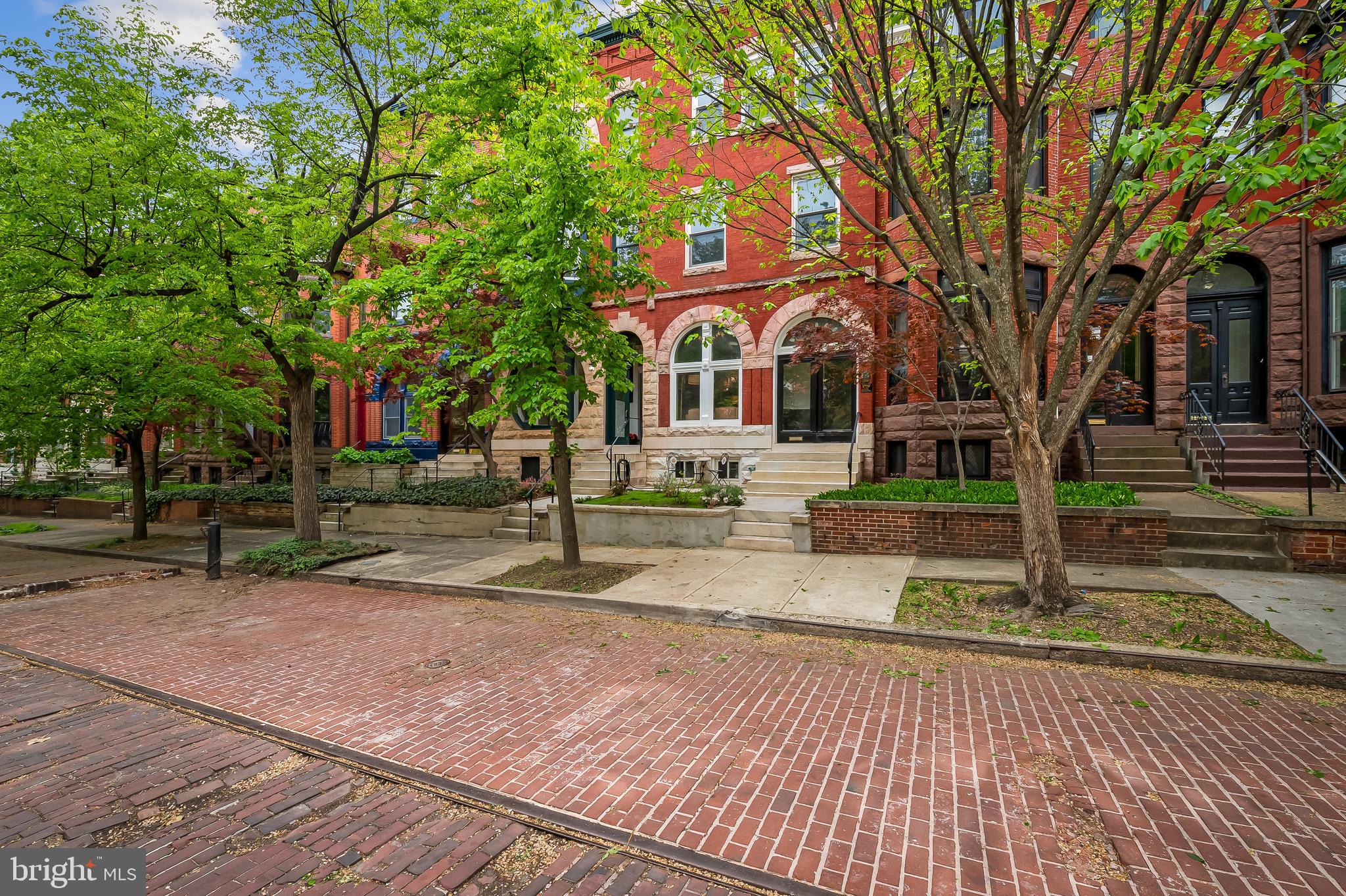 Price Improvement! $719k. Let’s get one thing straight: this isn’t your average, freshly flipped rowhouse. Tucked on a picturesque, tree-lined non-thru brick street—just a stone’s throw from a charming historic gazebo—this 1885 Victorian is in a league of its own. A home that doesn’t just blend past and present—it makes them dance.
From the moment you step into the Grecian key-tiled entry, you’re greeted by grandeur: monumental Eastlake gilded mirrors, ornate wood mantels, inlaid parquet floors, and staircases that carve their way elegantly through all three levels. Floor-to-ceiling windows face both northeast and southwest, flooding the home with natural light throughout the day, while the elevated position and thoughtful setback provide rare privacy for city living.
But this beauty isn’t stuck in the past. Every detail has been lovingly updated to blend modern luxury with timeless charm. Designer lighting is fresh and contemporary, complementing the home's historic elegance.
With five full bathrooms—including two with vintage clawfoot tubs for spa-like soaks—you'll have plenty of options for unwinding. And thanks to a shower on every floor, you'll never have to wait in line again. And the Carrera marble kitchen with Viking appliances will have even the humblest home cook hearing “Yes, Chef!” more than once.
Spanning over 3,000 square feet, this 5-bedroom, 5-bathroom home offers endless flexibility: space for offices, a workout room, a craft studio—whatever your lifestyle demands. A dedicated dining room off the kitchen invites long dinners and lively conversation, or slow Sunday brunches. Out back, enjoy a tranquil private yard with two trees and space for your own green thumb, and a two-car parking pad—because luxury is also about convenience.
Rich Farrow & Ball hues wrap the walls in warmth and sophistication, completing a space that is anything but ordinary. Thoughtful intention floods every room of the house.
And then, there’s the neighborhood. Just a short stroll to the newly refurbished Baltimore Penn Station, you’re perfectly positioned for daily DC commutes or spontaneous weekend escapes to NYC. Local gems like CookHouse serve up artisanal flavors, while cozy coffee shops are sprinkled throughout the neighborhood. Looking for a night out? The Baltimore Symphony Orchestra is just around the corner. Want to catch a game? The nearby light rail makes getting to the stadiums easy and hassle-free. Sumpter Park—perfect for dogs, kids, or solo afternoons with a book—is mere steps away. Tons of redevelopment is coming to the area just a few blocks away including a Streets Market which is a full service grocery store, Restaurant and additional shopping at the new Reservoir Square development.
Bolton Hill isn’t just beautiful homes and leafy streets. It’s a true community—an eclectic, welcoming mix of truly interesting people. Everyone’s got a story, and everyone is part of the neighborhood’s heartbeat. This is the neighborhood you already want to be in—and The Linden House is the only home for you.