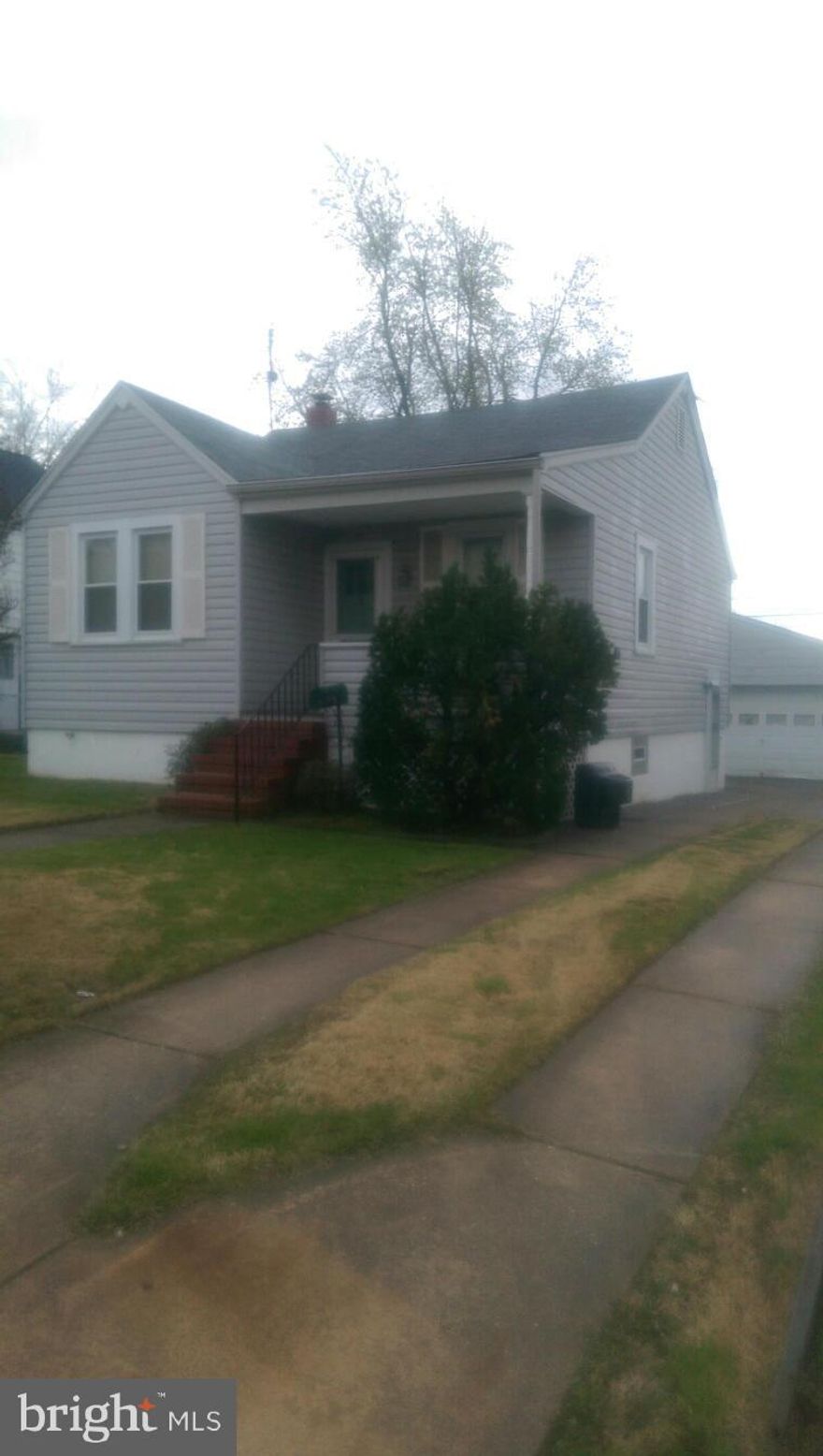 Great two bedroom home.  Large fenced in yard.  A hugh two car detached garage in the rear of the house for the family mechanic.  Kitchen was remodeled in 2014 with new floors counter top, cabinets,  stove, and dishwasher..  Living room has new carpet.  All appliances included (no micro) washer and dryer in lower level.  Trex front porch.