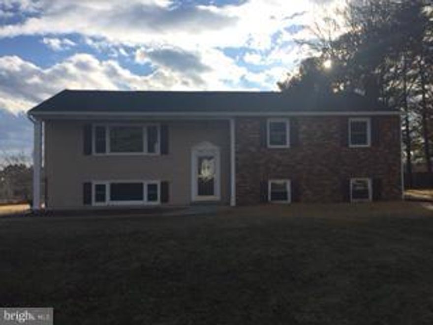 Completely Remodeled 4 BR 3 Full Bath Split foyer Custom Kitchen with granite counters and stainless appliances, Club basement with fire place and full bath and storage room. New heat pump air condition, Sun room off kitchen leading to back yard with a covered pavillion. Close to shopping and dinning. Owner is Realtor. A Must see, Still time to pick some flooring" QUALIFIES FOR 100% FINANCING "