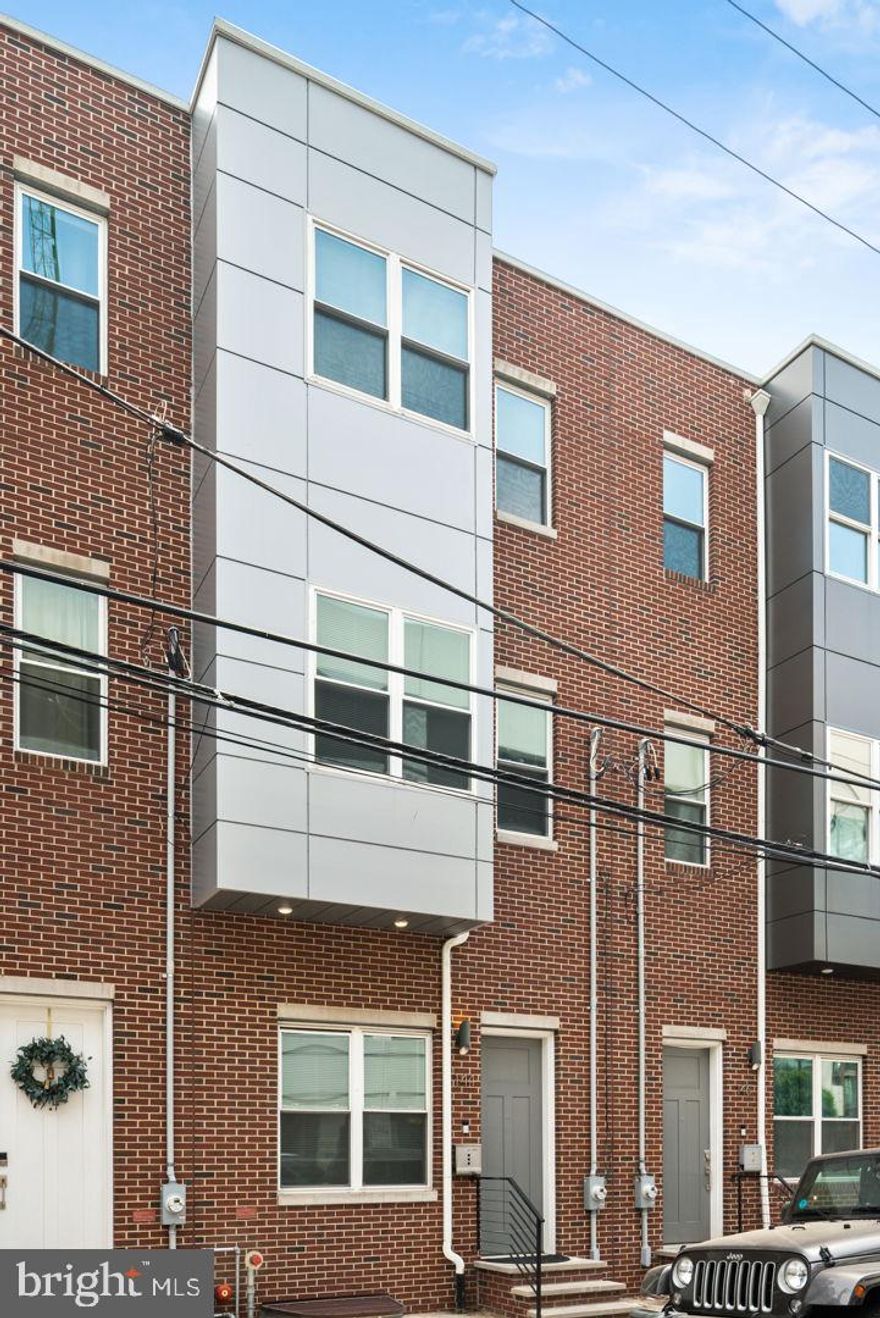 Recently built townhome in desirable Northern Liberties neighborhood. Enjoy the best of both worlds from Northern Liberties and Fishtown in this location. Located across from the Piazza, a block from the bars and restaurants along Second Street, a short walk to the heart of Fishtown and the Girard MFL stop. Tall ceilings, gorgeous hardwood floors, gourmet kitchen with huge island, Central Air,  perfect for relaxing and entertaining.  Off the kitchen, the back patio space is  complete with a gas line for grilling. The second floor hosts the primary suite with a generous closet and gorgeous ensuite bath  with double vanity, and glass enclosed shower. The third floor has two more well appointed bedrooms sharing a hall bathroom.  The finished basement features a full bathroom, convenient laundry area with storage, and one final bedroom. Walk up to the roof deck level and find additional space for a second living room, office, or bonus room complete with a wet bar for your roof deck! This will allow you to truly enjoy your roof deck by providing indoor and outdoor entertainment space.