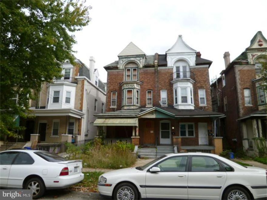 Large Twin Porch front Fired damaged 3 Family triplex close to University City and renovation was started on this Hugh stone property. The multi family unit has 3- 2 bedroom apartments. The property has sustained fire damage and is in need of repair. Property is sold in as is condition, All offers will be presented. buyer is responsible for u/o and title is good. $2000 minimum deposit and proof of funds.