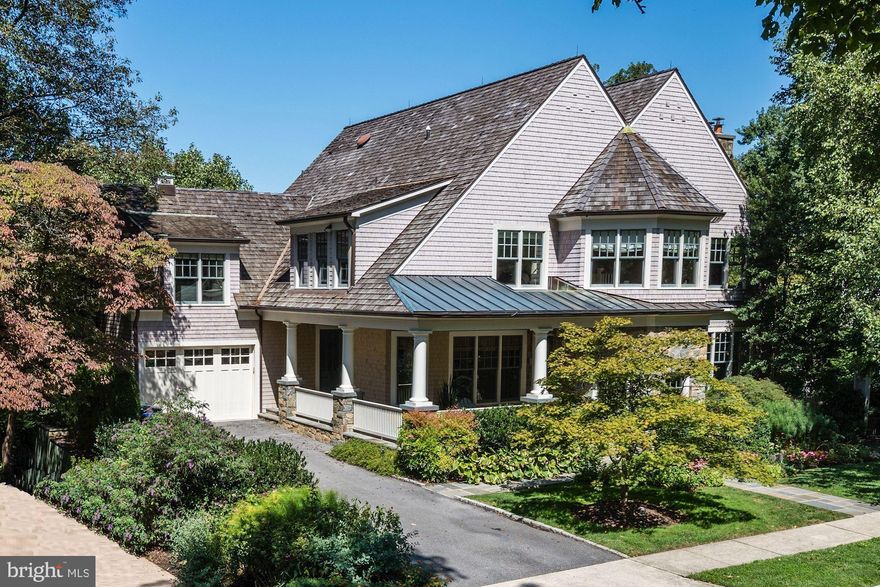 Fabulous custom built residence on large 1/3 acre along quiet Spring Valley street. A level front garden leads to the inviting covered front porch. Grand two-story foyer showcases a wrap-around staircase. Thoughtfully designed floor plan with generous ceiling heights and over 7000 sf of living space includes 5 BR, 4 Full + 2 Half BAs, 3 FP, interior-loading Garage, Top-of-Line Kitchen, Screened Porch, Wolf BBQ, Walk-Out Lower Level with Theater, Gym and more. Incredible Owner Suite features built-ins, luxurious en suite Bath, and a jaw-dropping Dressing Room w/ an abundance of custom wardrobes. Outside, a rear deck and screened porch, overlook the rear and side gardens, patios, and new hardscaped gas-lined fire-pit. Mature landscaping affords total privacy!! Must See!