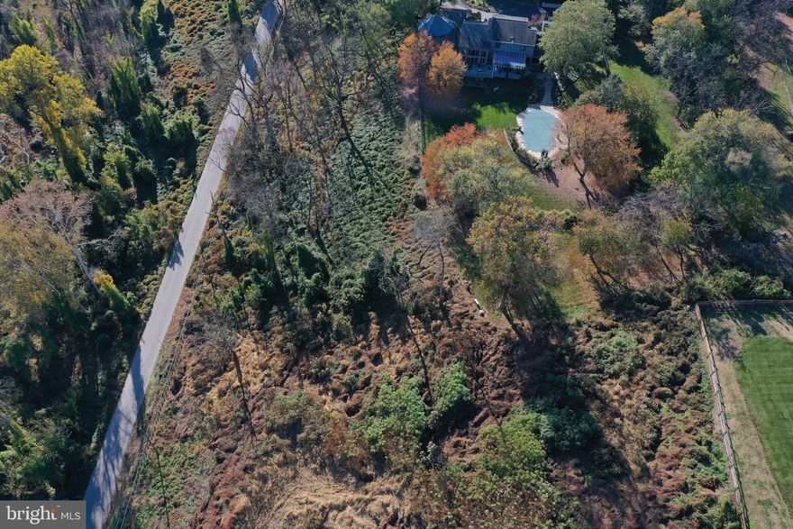 Rare Opportunity to Own 4.17 Acres in Prestigious Gladwyne

Discover a one-of-a-kind opportunity to own 4.17 acres of prime land in Gladwyne, PA, ranked #6 in the nation for average home prices. This exceptional property is situated just north of the Philadelphia Country Club and adjacent to the Riverbend Environmental Education Center, a serene haven with forested trails and natural beauty. With Sawmill Run Creek meandering through the property and flowing toward the Schuylkill River, this lot offers a peaceful, picturesque setting that’s perfect for creating your dream estate or making a valuable investment in one of the Main Line’s most coveted neighborhoods.

Property Highlights

• Architectural Plans

• A 5,000 sq. ft. (above grade) French Country/French Provincial-style residence designed by renowned Lower Merion Township architect Fred Bissinger.

• Includes plans for a 7,500 sq. ft. home with a walkout basement facing south, overlooking a tranquil forest near the golf course.

• Site Engineering

• Completed by Robert Lambert’s team.

• Stormwater management system updated to meet current codes, building upon the original professional design from 2000.

• Septic Permit, Approved and ready for use.

Recent Enhancements (Since 2021)

• Removal of damaged ash trees, invasive vines, and overgrown vegetation.

• Planted over 1,000 flowers, shrubs, and tree seedlings to enhance curb appeal and prepare the lot for development.

• Added ground cover grass and mini clovers for landscape improvement.

Location Highlights

• Prestigious Neighborhood: Situated in Gladwyne, one of the nation’s most exclusive and sought-after areas, offering privacy, prestige, and luxury living.

• Nature & Recreation: Adjacent to the Riverbend Environmental Education Center, featuring lush trails and scenic views.

• Prime Proximity: Across from the Philadelphia Country Club, a hallmark of luxury and distinction.

• Convenience: Minutes from top-rated schools, upscale shopping, fine dining, and major transportation routes.

Endless Possibilities

This property offers a rare combination of completed groundwork and design, giving you a head start in building your vision:

• Foundation Area: The lot has been prepared with a flattened foundation area.

• Stormwater Management: A partially completed, professionally designed system is already in place.

• Approved Septic Permit: Ready to support your custom development.

• 50’ Setback Variance: A grandfathered variance is included, adding unique value to this property.

• Zoning-Ready Package: Architectural, engineering, and zoning application plans are included, making the process seamless.

Why This Property Stands Out

Large, undeveloped parcels in Gladwyne are exceedingly rare, especially in such a desirable location. This property is a blank canvas for your custom estate or a strategic investment, combining privacy, prestige, and natural beauty with unparalleled convenience.

Included Documentation

• Permit for on-lot sewage disposal system.

• Land survey.

• Architectural drawings.

• Site Engineering drawjngs. 

Don’t miss this rare opportunity to create your dream home or investment in Gladwyne’s most exclusive area. For more details, please see the documents section or contact us directly.