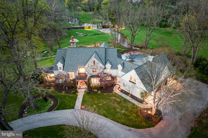 Look no further! This one of a kind, custom residence, featuring Rene Hoffman designs and masterful Dan Stoudt construction, is set on an absolutely breathtaking 13.9 acre lot complete with a scenic river and waterfall, close to renowned Tredyffrin-Easttown and private schools, trains, commuting routes and more. It is set back from the road in a very private location and is surrounded with vistas that will never change. Move right in and enjoy the sun-filled, open floorplan with gracious room sizes and endless, private views at every turn. Features include beautiful floors, architectural details and materials throughout, a spacious library with 2 walls of windows looking out over the grounds and patios with a fireplace, spacious dining room, great room with fireplace, large gourmet kitchen with bright breakfast room and adjacent screened in porch and pool area, fabulous primary suite with sitting room and luxurious bathroom, 2 additional bedrooms each with an en-suite  bathroom, 4th and 5th bedrooms with a large Jack and Jill bathroom and an expansive walk-out lower level with full bathroom and easy access to the beautiful pool and surrounding lawn.  Come home to serenity and your own private golf range, located at the rear left corner of this very special property. A rare find!