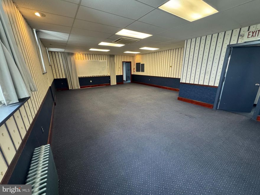 Available for immediate lease: a bright and spacious 2nd-floor office with ample windows offering plenty of natural light and views overlooking King Street. This 3-year lease includes a conference room with a whiteboard, a large bullpen area, a private office, two storage closets, a bathroom, and an additional storage room. With its open layout and abundant light, this space would also make a really cool private health club! Perfect for a growing business or unique concept—schedule a tour today!