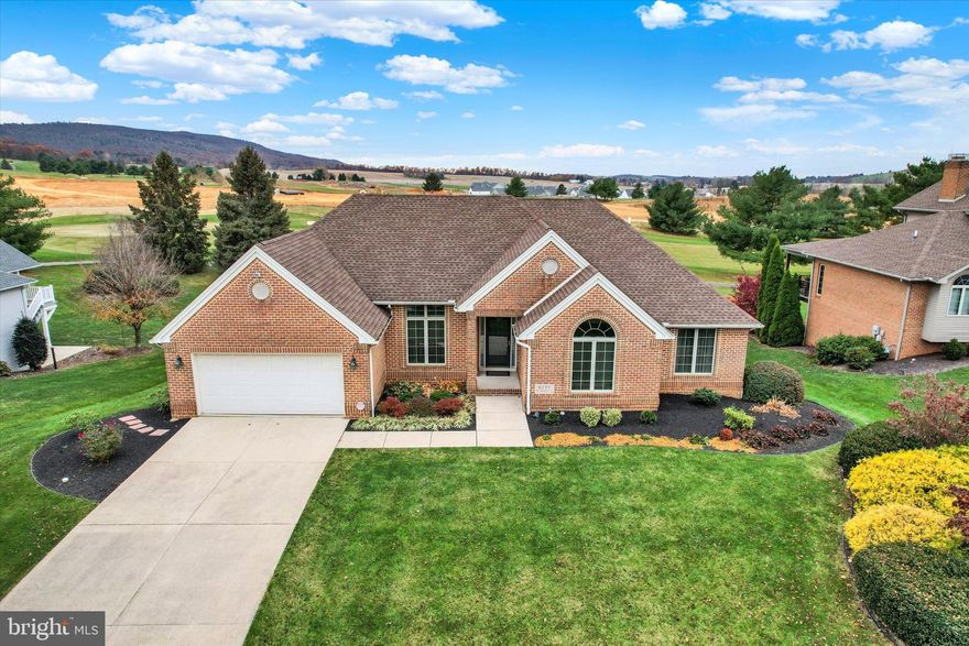 Beautiful custom built 4 bedroom, 3 bath all brick rancher located in the highly desirable golf course community of Penn National!  Built with exceptional quality and lovingly maintained by the original owners, this special home is a must see!  With sweeping views of the golf course and surrounding mountains, this home offers a picture perfect setting, abutting the 4th hole of the Iron Forge Golf Course.  Boasting 2281 finished square feet on the main level and another 2029 finished square feet on the lower level, this home offers endless possibilities for everyday living in addition to gatherings with friends and family.  Wonderful curb appeal with craftsman quality brick work and grouting wrapping all four sides, complete with a limestone engraved house number integrated into the brick facade.  Lovely foyer entry with marble flooring flanked by the formal living and dining rooms.  Straight ahead is the bright and spacious great room with marble gas fireplace and tall casement windows on either side to emphasize the view.  Step into the impressive kitchen with custom cabinetry, granite countertops and a beautiful dining area with walk-in bay window, perfect for taking in the serene setting.  Relax in the four season sunroom with awning windows or choose outdoor living on the 16 x 12 composite deck with bronze aluminum architectural columns and railing.  Primary bedroom with tray ceiling and two walk-in closets, leads to the primary bath with vaulted ceiling, skylight, marble flooring, whirlpool tub, two separate vanities, tiled shower and private water closet.  Another full bath services the second bedroom.  A convenient laundry room with utility sink and fantastic walk-in pantry completes the main level.  The lower level extends the living space with two additional bedrooms, another full bath plus a spacious family/media room with gas fireplace, custom wet bar and walk-out access to the patio and beautifully landscaped backyard.  In addition to an abundance of closet space, this level also features a large game room (the pool table remains), a workshop plus a flex room, currently used as a home office. Some additional features include a 2 car garage with opener, living room with elevated ceiling, hardwood flooring and Palladian window, dining room with transom window & lighted sconces, newer roof (5 years), full view door to sunroom, security system plus Weather Shield windows throughout.  Lovely, walkable community offers 36 holes of 4 star golf, outdoor pool, tennis/pickleball, community garden, coffee shop, 40+ social clubs, restaurant/bar and so much more!  See pro Shop for membership details.  A wonderful opportunity to make this your dream home!