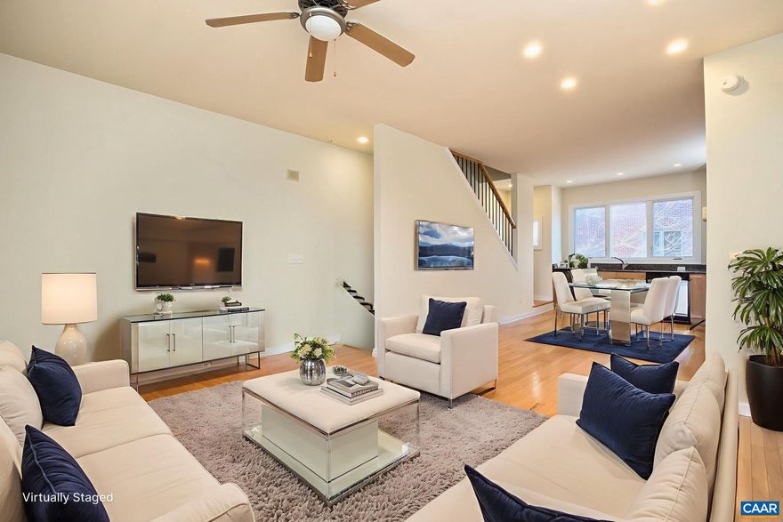 Instant equity! Recent appraisal at $340,000 Motivated seller, bring offers! Don't miss the opportunity to own this well cared for, maintenance-free end unit. The first floor features a convenient bedroom ensuite with a private entrance?ideal for guests, a home office, or flexible living needs. Also on the first floor is a finished garage space with a storage closet. The second floor boasts an open floor plan that includes a bright kitchen, dining area, and living room that flows onto an outdoor deck perfect for morning coffee or relaxing at the end of the day. The kitchen offers timeless finishes, including granite countertops, maple hardwood cabinetry, and abundant storage. The top floor includes two light-filled bedrooms, a shared bathroom with dual vanities, and a centrally located laundry closet for added convenience. The HOA covers exterior maintenance, trash, sewer, water, snow removal, and lawn care?truly lock-and-leave living. Fantastic location with easy access to Downtown Charlottesville, UVA, Interstate 64, and the scenic Monticello Trail. Water heater was replaced in 2023. Fresh paint throughout. Other interests within a 2-mile radius include the Downtown mall, Ting pavilion, multiple parks, PVCC, and much more!