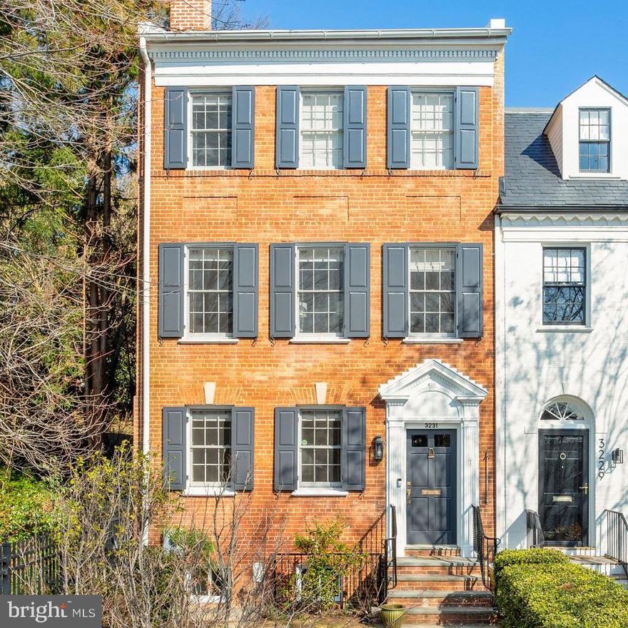This is the first public offering of 3231 Reservoir Road, NW since it was built in 1937. Sold privately to family friends ten years ago, the current owners completely renovated and expanded the house in 2015. This stately house has charm, light, and views. It is also flexible and versatile. With up to five bedrooms and a modern kitchen/family room, it makes a wonderful family house including both spaces for entertaining and for privacy. Located on top of the hill in Georgetown’s East Village, this house has pleasant views of the town and sky, and wonderful southern light.

The first floor consists of an entry hall with storage, a formal dining room, a wonderful eat-in kitchen with top of the line appliances, attached open family room and walks out to the terraced private garden. A laundry room and powder room are also on this floor. The second level has a cheerful living room and a library/bedroom with en suite bath. The third level includes the primary bedroom with ensuite bath and custom closet cabinetry, two more bedrooms and a hall bath. The lower level is an in law suite with private entrance, daylight, full bath, kitchenette, and storage room. The is a detached one-car garage accessed by the alley and the owners have approved plans to add a room above the parking.