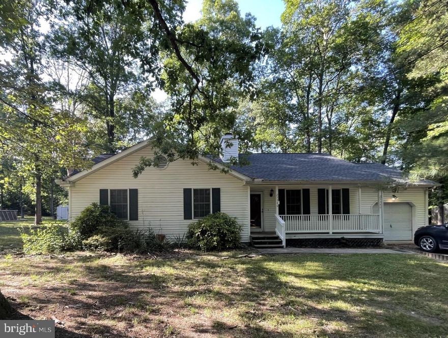 Opportunity Knocking!! Great home at a great price! 3 bedrooms and 2 full baths awaits your decorator touch in the Passapae neighborhood in Greensboro. Enjoy the warmth and ambiance from the Fireplace in Living room (wood burning with blower) Kitchen has peninsula with seating, opens to Dining room with sliders to the rear deck. Vaulted Ceilings in Living and Dining rooms!  Laundry is located at the end of the main hallway near the bedrooms, how convenient!! Primary bedroom has full bath with stall shower and walk in closet. Hall bath has tub shower combo.  Rear deck for summer grilling has steps down to a lovely Back yard that is fully fenced and is a level lot with some shade trees.  One car garage has storage room at the rear. There is even a Sweet front porch for sitting and relaxing!  This home is being sold As-Is yet is in move in condition.  Just minutes to downtown Denton and 14 miles to Route 50, this home has been well maintained structurally and mechanically as it has been a rental unit.  Roof replaced 2 years ago, Carpet 2 years, HVAC 9 years and Well Pump 5 years ago. Come and enjoy the beautiful Eastern shore!