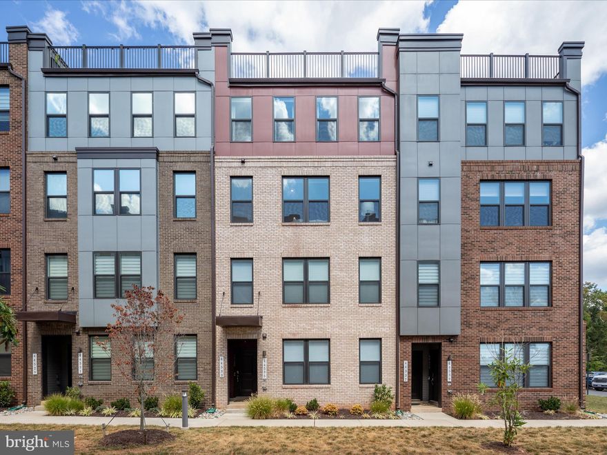 This is an exceptional opportunity to experience vibrant ONE LOUDOUN .... upscale dining, shopping, theatres, and farmer's market are just a short stroll from Wolfhound Sq!  A quality Stanley Martin new build with coveted wooded views!  This bright and open concept boasts durable luxury vinyl plank flooring throughout the main level.  Kitchen enthusiasts, rejoice!  This home features custom cabinetry that maximizes space with style, including a built-in coffee bar that adds both charm and convenience.  Designed with elevated finishes and clever storage throughout, the kitchen blends timeless elegance with modern functionality including Cafe induction cooking, double wall ovens, walk in pantry, and an expansive prep island.  Work from home just got an upgrade! This home features a custom-designed office complete with built-in cabinetry and desk space - ideal for professionals, creatives, or students.  Seamlessly blending functionality and style, the workspace provides ample storage, clean lines, and clutter free environment.   Enjoy crisp fall afternoons on your covered balcony with plentiful outdoor seating.  A luxurious Primary suite includes a walk-in closet and ensuite bath (dual sinks and oversized shower!).  Generous secondary bedrooms and accessible upper level laundry. One car attached garage. EXTRA EXTRA EXTRA - enjoy the added convenience of custom motorized blinds, ceilings fans, and designer lighting!<br><br>LOCATION, LOCATION, LOCATION! The Ashbrook Community is located next to the premier One Loudoun! In addition to Barnes and Noble, Starbucks, Trader Joes, MatchBox, Bar Louie, and The Alamo - you benefit from nearby Metro access, Dulles International Airport, and Washington and Old Dominion Trail! And, less than 30 mins to Tysons Corner, Capital One Hall, Wolf Trap Center for the Performing Arts, Great Falls National Park and so much more!