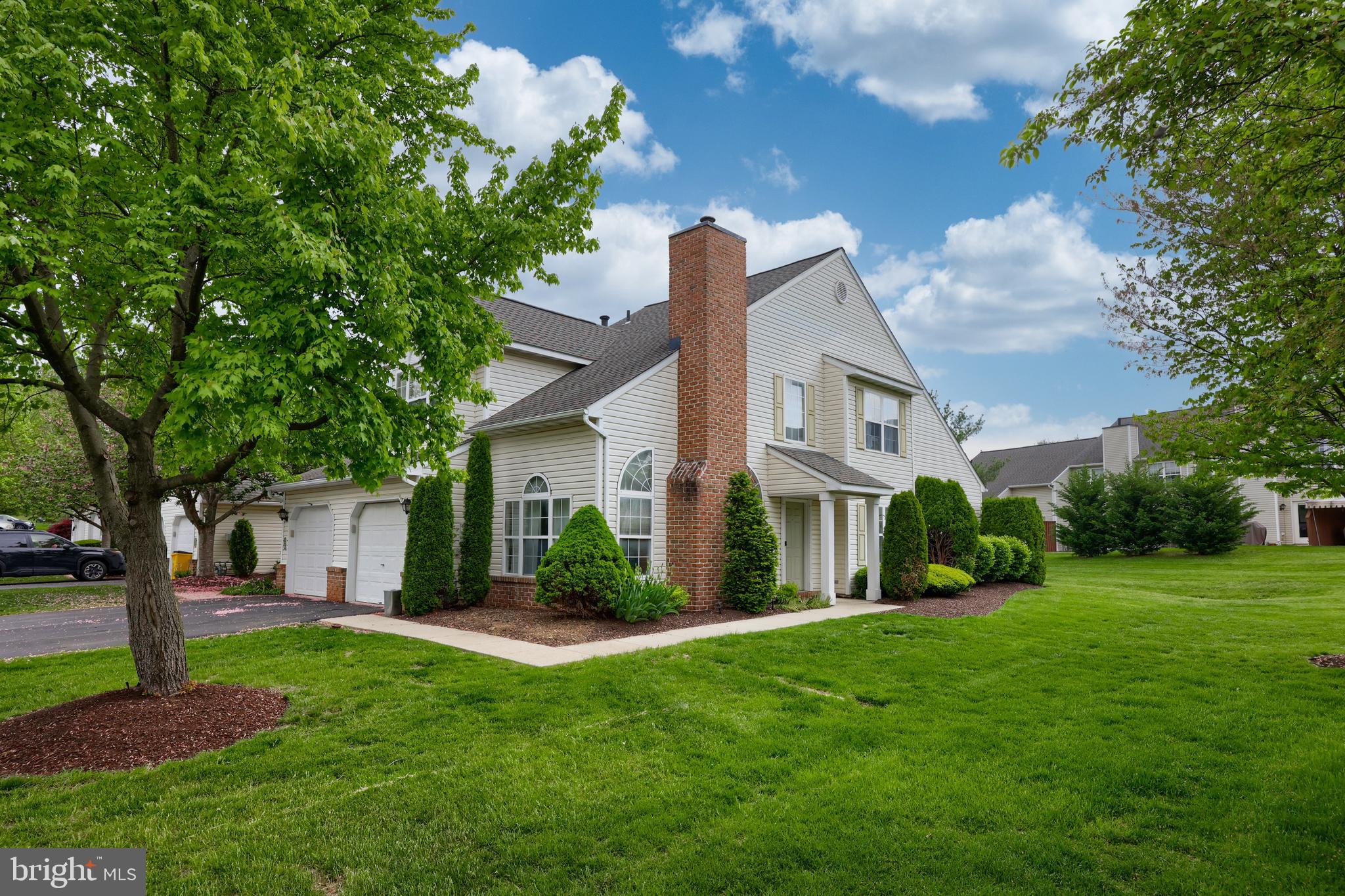 Rare, Spring Ridge End w/ 1st Floor Master
If you’re one of the many people eager to call the highly desired Hickory Hill of Spring Ridge home, then this is your chance! This beautiful property is one of only a handful of end units with a sprawling, flat yard and private side entry.
As soon as you step inside, you’re greeted by a two-story, tile foyer that flows openly to the main living spaces. To your left, you’ll find the bright and open living room with soaring vaulted ceiling with a fan, a gas fireplace framed by tall windows, and light carpeting.
Next door, the spacious dining room has elegant touches with a large front window and matching carpet.
In the kitchen, the family chef enjoys a tall, vaulted ceiling, Quartz countertops, tile backsplash, a new sink, and built-in stainless-steel appliances, while an eat-in breakfast room with a slider to the back patio is a great space to enjoy morning coffee or family breakfasts.
The first floor Master bedroom features a vaulted ceiling with a fan, large double windows, two closets, and a private tile bathroom with a built-in vanity and step-in shower with a bench.
Upstairs, you have a bird’s-eye view of the living spaces below. Two sizable, secondary bedrooms enjoy light carpeting while sharing a full hall bathroom with tub/shower, as well as a storage room.
Your attached, one-car garage can be directly accessed by the main level laundry/mudroom, while a nearby powder room with built-in vanity offers even additional convenience.
And finally, enjoy the quiet, peaceful surroundings of this lovely neighborhood while overlooking expansive green space from your back patio.