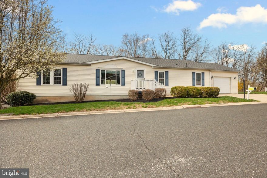 Welcome to Creekwood Village, a quiet senior community tucked away in the rural hills of beautiful Skippack Township. This home features 3 bedrooms, 2 full bathrooms, an oversized 1 car garage and a fabulous bonus of a full finished basement! If you are looking to downsize to one floor living but still need the space for storage and for family gatherings, this home definitely is the answer. As you enter into the cheery living room filled with natural light from the beautiful picture window, you will feel the warmth and comfort of home instantly. The living room leads into the expansive eat-in kitchen with a large center island, corian countertops, double sink, newer dishwasher(2024) and garbage disposal(2023), as well as an abundance of cabinetry to store all of your small appliances. There are sliders that lead out from the kitchen to the huge 40' x 14' rear deck, to enjoy the private and scenic views of all that nature has to offer. Back inside from the deck there is another door that leads into the laundry room, which is located just off the kitchen. There is a cozy family room open to the kitchen with propane gas fireplace and ceiling fan. You can opt to make this room into a dining room to entertain your family and friends, just as the current owner has done. On one side of the home, you have the comfy Owner's suite with a 10' x 5' walk-in closet, ceiling fan and attached spacious bathroom, with a two sink vanity, soaking tub and stall shower. Follow the easy to clean and maintain natural colored laminate flooring throughout, to the opposite side of the home, where you will find two other bedrooms and a full bathroom with tub shower. A spectacular option not offered in every home in this community is the humongous full finished basement with sliding glass doors out to a patio. The roof is only 3 years old, recently installed in 2022 and HVAC in 2017. Most windows and the sliding glass doors to the deck have been replaced. Parking is not a problem with the expanded driveway for two vehicles. Take a stroll down the street and enjoy gathering with your new neighbors at the beautiful pool and clubhouse. Make your showing appointment today!