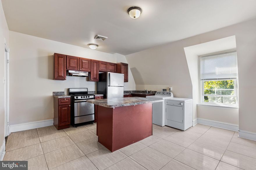 Move right in to this Overbrook gem!  2 bed 1ba with minimal living room or utilize as a sprawling one bedroom.  3rd floor walk up featuring stainless steel appliances, washer dryer and kitchen island.  Tenant pays utilities.