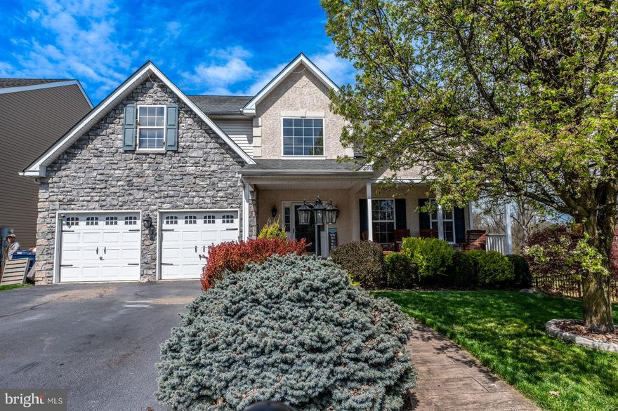 Welcome to this incredible home located in Hawthorne Estates within the prestigious Boyertown School District. Boasting 5 bedrooms and 2 1/2 baths, this stunning residence offers a wealth of luxurious features and amenities. As you approach, the inviting curb appeal welcomes you with a charming covered front porch, perfect for enjoying quiet moments. Step inside and be greeted by the grandeur of the two-story foyer adorned with elegant wainscoting and gleaming hardwood flooring that flows seamlessly throughout the first floor. The formal living room and dining room, enhanced by a bay window, provide an ideal space for entertaining. The recently renovated gourmet kitchen is a chef's delight, featuring double ovens, a spacious island, granite countertops, and huge pantry. Adjacent, the two-story family room offers a cozy gas fireplace and additional built-in storage. A first-floor bedroom, currently utilized as an office, adds versatility to the floor plan. Upstairs, the master suite boasts a vaulted ceiling, a custom walk-in closet, and a luxurious ensuite bathroom. Three additional spacious bedrooms and a well-appointed hall bath complete the second floor. The finished basement offers the ultimate entertainment experience with a home movie theater, bar area, and game room. Step outside to the covered patio, complete with swings, a hot tub, and a TV, providing the perfect retreat for outdoor enjoyment. Additional highlights include a holiday decorative lighting system, a Brinks security system with exterior cameras, a brand-new top-of-the-line $22,000 Lennox HVAC system, California Closet built-ins, and more. With its prime location backing to open space and offering unparalleled privacy, this home truly embodies luxury living at its finest.