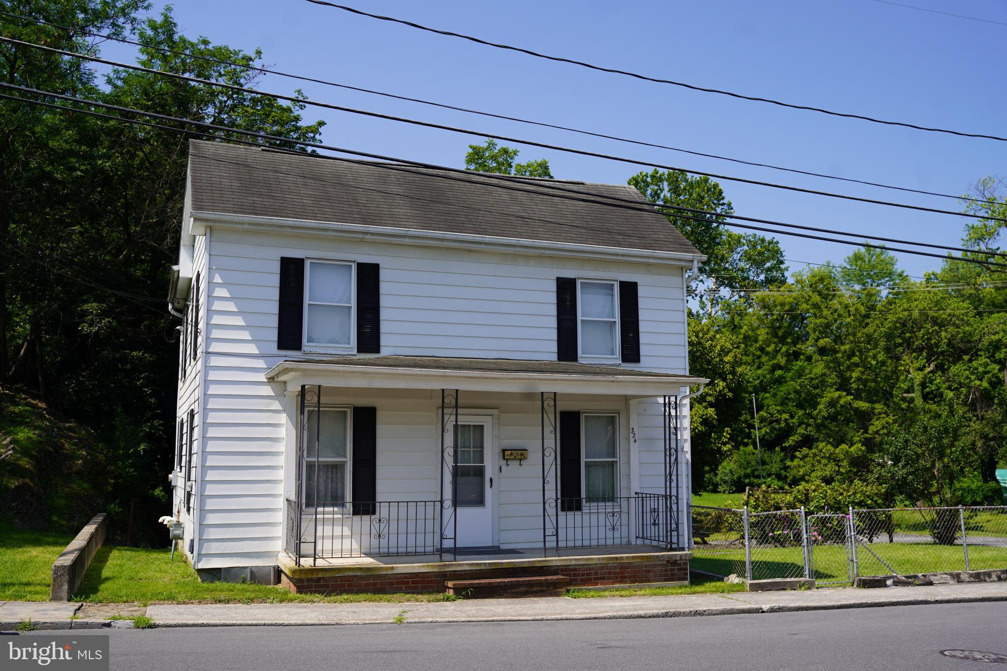 Welcome to 324 E Stephen St, a charming 3-bedroom, 1.5-bathroom colonial located on two lots totaling .22 acres in Martinsburg. This property features beautiful hardwood flooring throughout, creating an inviting and cozy ambiance. Enjoy year-round comfort with central air and efficient gas heat. Situated near city parks, and just moments from the commuter train station, convenience is truly at your doorstep. An additional parcel enhances this property's appeal, with the tranquil Tuscarora Creek flowing gently through it. Please note that the tax maps reflect a High Risk flood zone area, so it is important to review any applicable regulations. With its ideal location and charming features, this property offers a wonderful opportunity to enjoy both comfort and convenience in Martinsburg.