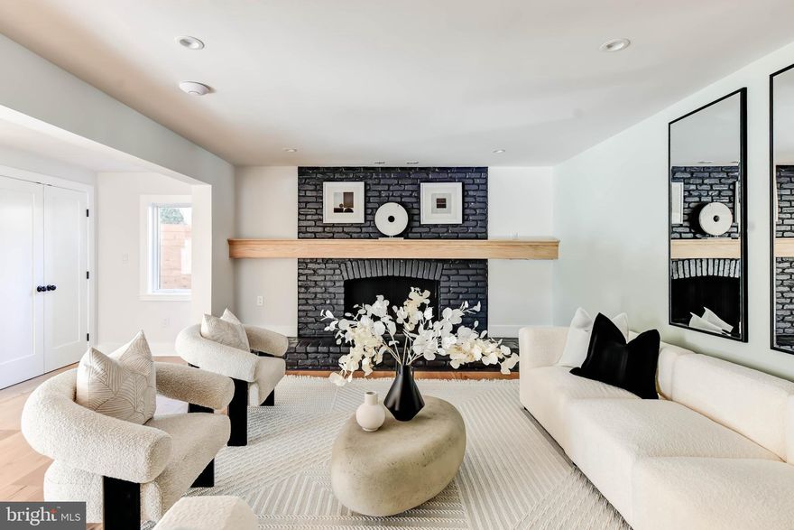 4624 Asbury Place is nestled on a quiet 2-block street in the heart of American University Park.  Beyond the charming facade, this expansive home offers over 5300 square feet of well thought out living space along with an amazing roof deck, a great sized yard, garden and more.  Meticulously crafted with a focus on both form and function, this home is a sanctuary for those who appreciate quality and design. As you step inside, you’ll be welcomed by a spacious living area adorned with a charming gas fireplace, setting the tone for cozy gatherings. A generously sized office/flex space offers versatility, whether you plan to use it for productive work days or transform it into a playroom to capture playful family moments. Continue your journey into the family room, warm up next to your wood burning fireplace, entertain in the elegant dining room, perfect setting for hosting memorable evenings, a serving station with a wine refrigerator separates the space.

The kitchen is a masterpiece for culinary enthusiasts. It showcases sleek custom cabinetry, quartz countertops, and top-of-the-line Thermador appliances. Tucked away is every chef’s dream, a large food prep area with additional cabinet storage, sink and expansive pantry. The large mudroom just off the kitchen provides convenient storage solutions for your everyday needs. Enjoy a comfortable deck directly off the kitchen and mudroom accessing the backyard.

Ascending to the second floor, you’ll find five generously appointed bedrooms and three designer bathrooms. The large windows in the owner’s suite give you a feeling of being perched in the trees and also features a spacious walk-in closet and a spa-like bathroom with dual sinks, designer tile, a soaking tub, and a luxurious glass-enclosed shower. Next to the owners’ suite, the washer and dryer are conveniently located on this bedroom level. Not to be missed is the sprawling 1000 square foot private roof deck with a misting system and dedicated coffee/wine bar area equipped with a mini fridge, sink, and storage. The roof deck is perfect for relaxing with friends while enjoying tranquility. You will forget you’re in DC.

The lower level offers additional living space, boasting a large family room with a gas fireplace eating area, two bedrooms, a bathroom, a full kitchen, and separate laundry. This versatile space, with separate entrance, can be used as an au pair suite, in-law apartment or rental income unit. 

The large fenced-in yard offers a place to unwind at the end of the day. You’ll  find a vegetable garden, and plenty of shade from the many trees. A detached garage has ample room for two cars plus 2 additional off-street parking spots. Storage will not be a concern with storage in the pull-down attic of both the house and garage.

4626 Asbury Place NW is located in the heart of American University Park/Friendship Heights. This gem is a mere stone throw away from some of the area’ s hottest destinations, including the beloved Millie Restaurant, the gourmet haven Wagshal’s Grocery, and a local favorite, Compass Coffee. What’s more, this prime location offers the ultimate commuter convenience, as it’s strategically positioned less than a mile from the red-line metro. This means you’ll have seamless access to the entire city, allowing you to explore its dynamic neighborhoods, cultural treasures, and business districts with unparalleled ease.