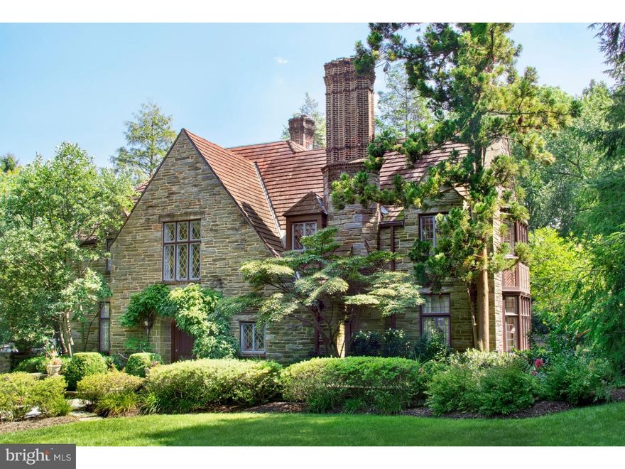 Situated a stone's throw away from the Merion Cricket Club and the Haverford train station, this stunning stone Tudor dating from 1920 is set back on its impressive acreage behind low brick privacy walls running the length of the property's frontage.  Featuring exceptional original millwork and other fine architectural details, the 6,637 square foot manse offers both high-ceilinged, elegant formal entertaining spaces and inviting casual living areas distributed over four stories.  The beautifully tiered rear grounds are magnificent and boast a gorgeous pool, spa, and waterfall in addition to mature plantings.