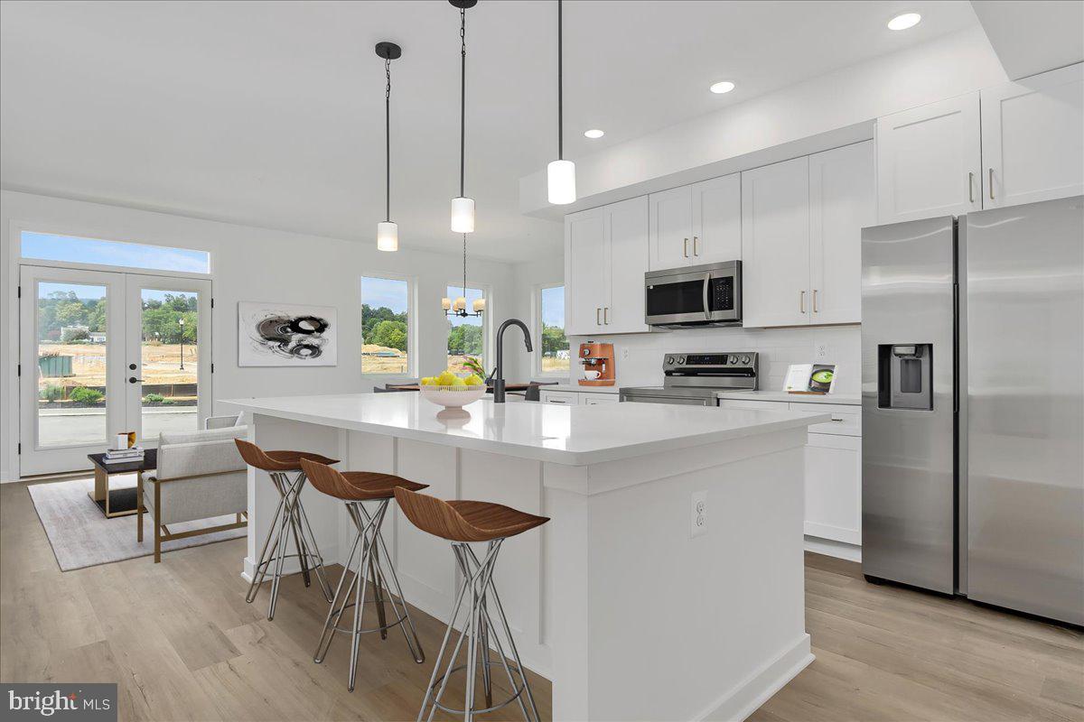 **Quick Move-In Luxury Condo – $10K Builder Credit with Preferred Lender & Title** Welcome to the Sedona floorplan, a thoughtfully crafted home that seamlessly blends modern convenience with the ease of single-floor living. Scheduled for a summer move-in, this brand-new condo features the timeless and elegant Shenandoah design package. Situated on the ground level, this desirable end-unit offers convenient access to the attached garage and patio. The open-concept layout showcases abundant natural light, and seamless flow between the living, dining, and kitchen spaces. The main level includes the owner’s suite, while the upper level provides a private second bedroom with its own full bath—perfect for guests or additional living space. Ideally located near I-70, I-270, and Rt. 15, this community places shopping, dining, outdoor recreation, and downtown Frederick just minutes away. Don’t miss the chance to own this beautifully designed home—schedule your tour today!