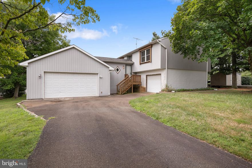 Welcome to this charming 2-bedroom, 1.5-bath split-level home nestled in the serene Rolling Hills community of North East, just off the picturesque Elk River. As you step into the welcoming vinyl-floored foyer, you'll immediately feel at home. The upper level features a spacious living and dining room combo with cozy carpet and two sliding glass doors that lead to an oversized, fully covered rear deck, perfect for relaxing or entertaining. The adjacent kitchen, with its practical vinyl flooring, is both functional and inviting, ready to inspire your culinary creativity. Down the hall, you'll find two well-appointed bedrooms with comfortable carpeting. The second bedroom boasts convenient shelving, ideal for organization. The full bath offers a tub/shower combo and vinyl flooring to cater to all your daily needs. The lower level presents a versatile den that can easily serve as a third bedroom. This space includes vinyl flooring and a sliding glass door opening to a rear patio, seamlessly extending your living area. A convenient half bath is also located on this level. Outdoor enthusiasts will appreciate the home's many amenities. The fully covered deck, complete with a swing, offers a tranquil spot to unwind, while the patio beneath provides additional seating space. A storage shed offers ample room for all your gardening tools, and the property includes an open trailer for your use. Parking is easy with two attached garages—one accommodating up to two cars and the other accommodating one car—along with an additional asphalt-paved driveway that can fit two or more vehicles. This home truly has it all, blending comfort and convenience in a delightful package. Don’t miss your chance to make this North East gem your own. Schedule a tour today and experience all that this exceptional property has to offer!