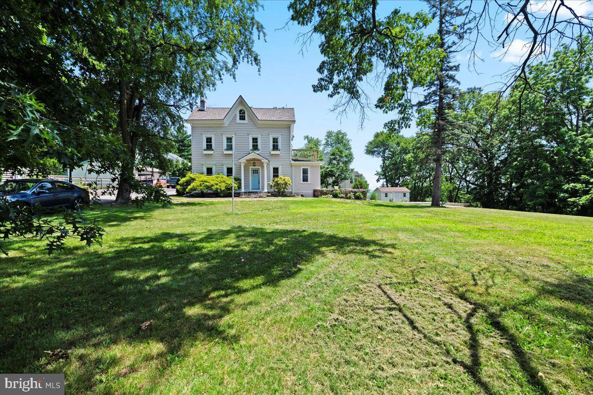 This beautifully remodeled home is truly the best of both worlds, offering all the strength and charm of a home originally built in the 1800's, with the convenience and peace of mind that only brand new systems, upgraded finishes, and a builder with over 20 years of experience can bring. This masterful remodel offers new dual zoned HVAC, all new plumbing and electric with 200 amp panel. New doors, windows, and gorgeous 3/4" white oak hardwood are just some of the wonderful things this home has to offer. The only stone left unturned rests in the beautiful, double-sided, wood burning fireplace-- already run with an empty gas line for the option of easily converting to gas fuel. This stunning stone and brick fireplace connects the chef inspired kitchen with the spacious and sun filled living room. The kitchen has been outfitted with an upgraded stainless steel GE gas appliance package, level 4 granite countertops, marble backsplash, and solid wood, soft-close cabinets, while the living room is perfect for entertaining, complete with french doors that open to an elevated brick patio- ideal for outdoor dining or an afternoon of quiet relaxation.
The first floor has a dedicated laundry suite and full bathroom, allowing for the easy accommodation of a first floor living area. The second floor has 2 full bathrooms and 3 bedrooms, with the primary boasting a private porch to enjoy your morning coffee or an evening sunset. On the 3rd floor you'll find 2 more rooms offering the possibility of additional bedrooms, a playroom, office, or extra storage. As you walk outside you'll notice patios off of the kitchen and living room, as well as a wood burning fire pit area on a raised platform, a shed with plenty of storage space, and of course the plot's original springhouse, complete with turtle shells, commonly used for drinking from the spring in the late 1800's.
Perched on a substantial .85 corner lot just a few minutes from downtown Phoenixville, it is part of the highly sought after Spring-Ford School District- ranked in the top 5% in the state. This home is the rare blend of a skillful renovation done with the utmost care and attention to detail, while respecting the beauty of it's original structure. Come see what makes this home truly special!