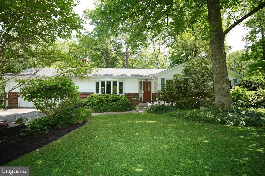 Charming rambler on beautiful landscaped 1.38 acre.   Home has been well maintained.  New roof & gutters in 2021.    Heat pump is 5 years old  but new condensor &  has oil back up.  Replacement windows. Tankless hot water heater in 2018.  Remodeled kitchen & hall bath.  Hard wood floors.  Basement is partially finished. Entertain on the  custom 900 sq foot  patio with pergola, griling area,  firepit, electric & drip irrigation.  Gorgeous landscaped lot.  Level yard.  plenty of room for soccer or swimming  pool!!!