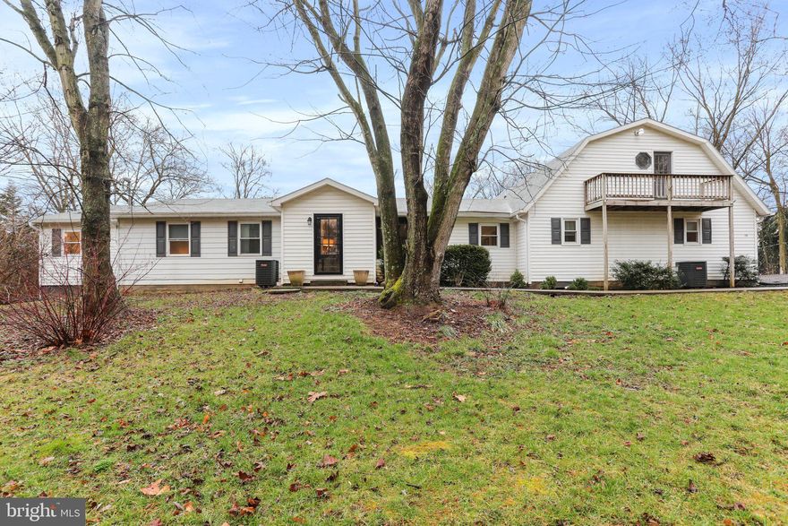 Opportunity knocks! Opportunity to live in one side and rent the other! Opportunity for modern and up to date multigenerational living! Opportunity for aging teens to establish independence while still saving for their own home! Opportunity for in-law or au-pair suite! Truly, the sky is the limit with this charming and move in ready dual home! The main portion of the home boasts 4 bedrooms and 3 full baths! The main level offers an oversized dining area with a slider to a fenced rear yard. The current owner carefully and tastefully selected finishes and wall paper that set this home apart from others! Numerous updates to include appliances, light fixtures, flooring, and some windows. The primary suite offers a walk in tile shower and owners porch. The lower level is mostly finished with a game room, family room, possible bedroom and framed area for bath! The secondary home is also cute as a button and move in ready! The main level offers a kitchenette with eat in dining area and separate bedroom and/ or office! The upper level has a living room, bedroom and full bath! The secondary bedroom also has it's own private balcony and rear deck! The rear yard has 5' fenced area and offers lots of privacy! The horseshoe driveway allows for numerous vehicles and toys! Attached 1 car garage and/ or additional living/ storage space and also detached 2 car garage/ barn! Darling playhouse that could also be used as an art studio, yoga studio or garden shed! Potomac River community access, perfect for fishing, wading, kayaking or floating! Fantastic commuter location to MD, VA & PA!