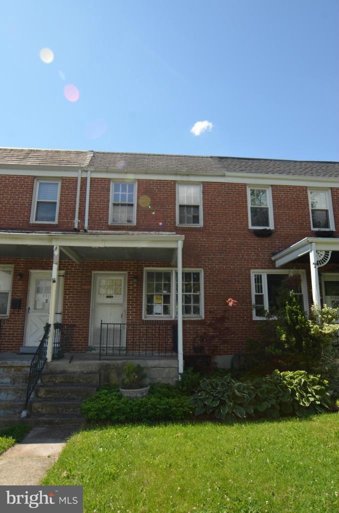 2BR 1.5 BA Attached row house w/ front porch, Sep LR/DR, Kitchen w/ access to balcony, fenced rear. Needs work, but has lots of potential. *Buyer to verify ground rent, Seller will not redeem*