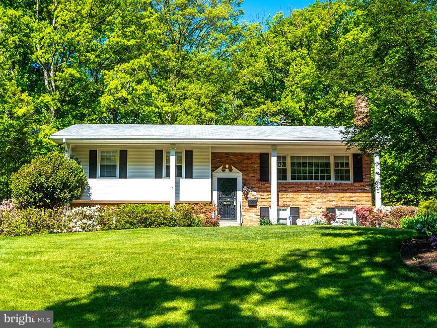 Looking for a home that has been redesigned for today’s lifestyle? Want a yard that is large enough for a fire pit, pool, garden and/or sports areas? Prefer an excellent location inside the Beltway with easy proximity to 495, 395, Starbucks, shopping, restaurants, County parks ? This delightful home is perfect for you!  Living room with hardwood flooring, cozy wood burning fireplace and tons of natural light.  Spacious dining room perfect for entertaining or holiday gatherings. The “great room” truly a gem and the relaxing gathering place for this exceptional home: 500 square feet of uninterrupted living space with windows on three sides overlooking the back yard, areas for the chef to whip up a quick snack or gourmet delight while participating with activities in the family or casual dining areas as well as the sizeable deck. Three upstairs bedrooms, all with hardwood flooring; primary with en-suite bath; hall bath with tub. Lower level includes two additional bedrooms, third full bath with tub, generous sized recreation room with second wood burning fireplace with space for entertainment and game areas, huge utility/ storage/laundry/workshop with direct access to lower patio and rear yard.   Massive two car-garage with potential workshop area as well as multiple doors to the yard. The grassy treed rear yard, both flat and deep, offers opportunity for a panoply of activities; rustic shed ideal for yard implements and equipment storage. Gas heat, hot water and cooking.  Situated in a vibrant community with an active civic association that sponsors block parties, an annual children’s carnival, food trucks, Halloween children’s parade, and much more.  The dominant impression of this exceptionally pleasant neighborhood is towering trees that provide shade and privacy for the half acre lots. Hillbrook/Tall Oaks is a true oasis inside the Beltway. This estate conveys “as is, where is” with no warranties, representations or guarantees.