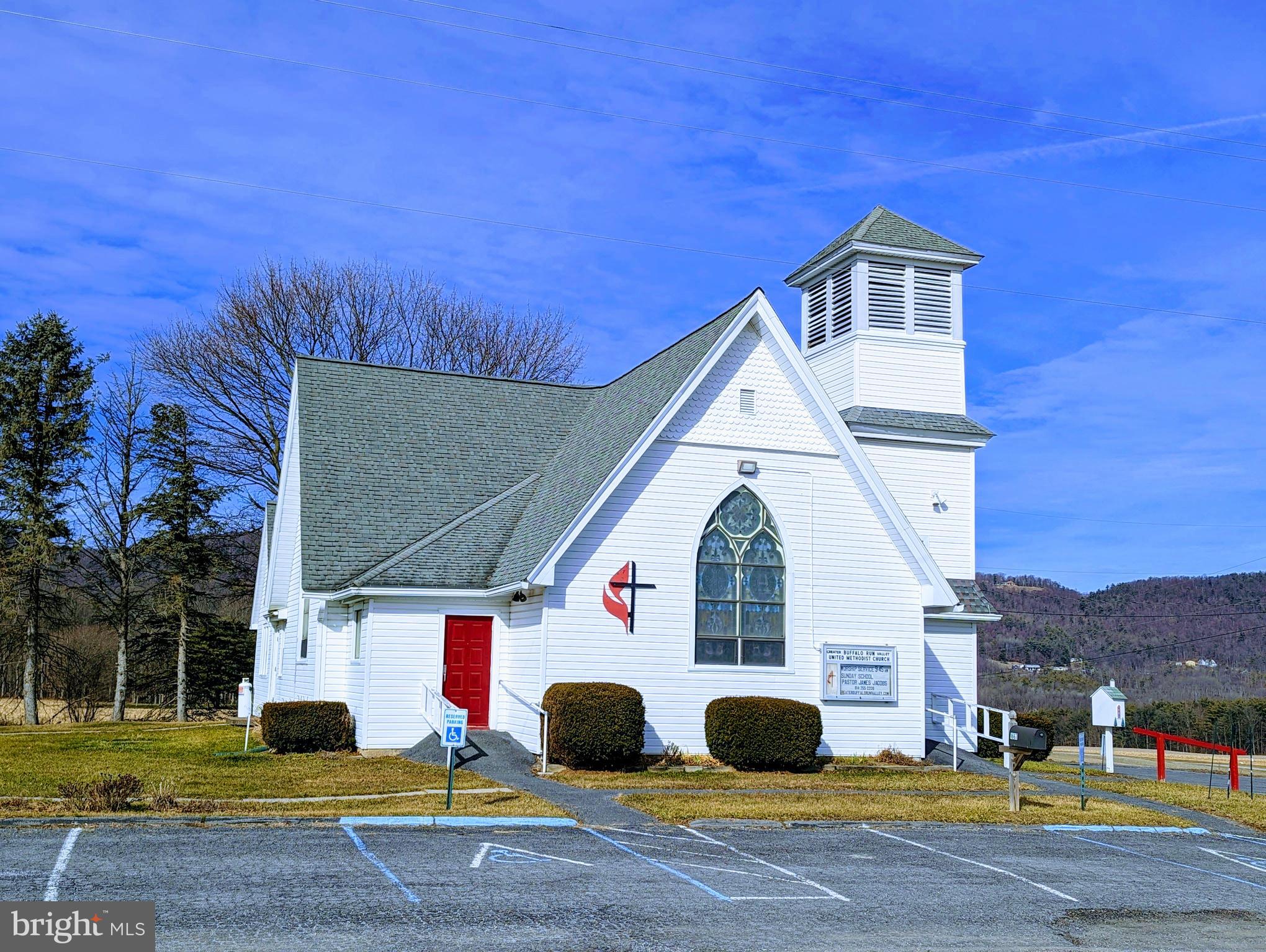 Rare opportunity to own a highly visible Church in Benner Township with beautiful panoramic farmland views along Buffalo Run Road! Great location only 6 miles to the Penn State University campus, 4 miles to downtown Bellefonte, and 2 miles to the State College airport. Dedicated at this site in 1899, the building has been used by three different congregations and now needs another church family to call it home. The Deed requires the usage to remain for church purposes. The building has been very well maintained and has undergone many improvements throughout the decades with the exterior siding replaced in 1987, the stain glass windows restored and a new roof installed in 2007. There are two front entrance foyers into the main level which features a nicely sized Sanctuary and Altar, an Office area, four Classrooms, and two half Bathrooms. A side door provides access to the lower level which has a large Fellowship Hall, a full Kitchen, Prep area, Storage rooms, and two additional egress exits. The paved lot currently offers 33 parking spaces with an adjoining dirt area for additional vehicles. Property is being sold AS IS.