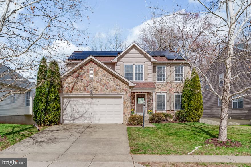 There’s no place like home in Patriots Glen! This stone-front home offers a well-balanced layout designed for everyday living. The main level features an open floor plan with a family room centered around a gas fireplace, an eat-in kitchen with island, and access to the back deck. A separate dining room and living room provide additional space, along with a mudroom and pantry area with access to the 2-car garage. Upstairs, you’ll find all four bedrooms along with second floor laundry. The primary suite includes vaulted ceilings, a walk-in closet, and a private bathroom, while the additional bedrooms offer large walk-in closets with built-in storage systems. The walkout basement includes rough-in plumbing and is ready for future finishing, offering flexibility for additional living space, a home office, or recreation area. Outside, the back deck and front patio provide spaces to enjoy the community setting. Recent updates include brand new carpet and a new roof and owned solar panels installed in 2019. Located in the Patriots Glen golf community, now featuring the Launch Zone driving range, with convenient access to Delaware and local commuter routes. Within the neighborhood, you’ll find the Tavern at Patriots Glen, a community fitness center, community pool with kiddie pool, tennis courts, and playground. Schedule your private showing today to see everything this home has to offer!