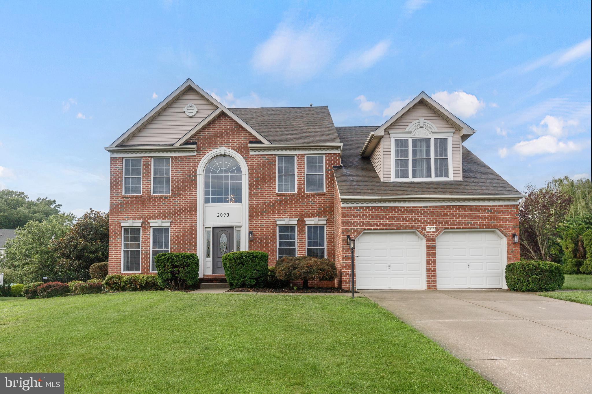 Welcome to 2093 Titan Terrace, an exceptional home located in the highly sought-after Greens at Rock Glenn community of Havre de Grace—just a swing away from Bulle Rock Golf Course! This beautifully maintained residence offers over 5,000 square feet of thoughtfully designed living space, blending luxury, comfort, and functionality.
Step into the dramatic entry foyer and main living area, where soaring ceilings and a large arched-top window flood the space with natural light. A striking geometric chandelier makes a bold design statement, while the open-concept layout connects the main living room, dining room, and kitchen for effortless flow. The formal dining area is accented with classic chair rail molding, and the gourmet kitchen is beautifully appointed with stainless steel appliances, a six-burner gas cooktop with vented hood, granite countertops, mosaic tile backsplash, and both pendant and recessed lighting. A large center island with bar seating offers additional prep space and casual dining. Just off the living area, a private office/den with French doors provides a quiet space to work or relax, and a modern half bath completes the main level.
Upstairs, the interior balcony overlooks the expansive main floor and leads to the oversized primary suite, featuring a vaulted ceiling and abundant natural light pouring in through large windows. The spa-like en suite bathroom includes LED-lit mirrors, a soaking tub, and a gorgeously tiled walk-in shower with dual brushed gold rain showerheads and coordinating gold finishes. Three additional spacious bedrooms and a full hall bathroom with dual sinks complete the upper level.
The fully finished basement is an entertainer’s dream, offering a large recreation room with a custom full bar and built-ins, recessed lighting throughout, and ample room for lounging, games, or gatherings. A dedicated home theater room with surround sound creates the ultimate cinematic experience. The lower level also includes a private bedroom and an additional full bathroom, making it perfect for guests or extended family.
Step outside to enjoy the expansive rear deck, which leads to a lush, professionally landscaped, and well-manicured backyard—perfect for outdoor entertaining or peaceful relaxation.
Ideally located just minutes from shopping, dining, and the waterfront charm of downtown Havre de Grace, this stunning home offers the perfect balance of elegance, space, and lifestyle convenience.