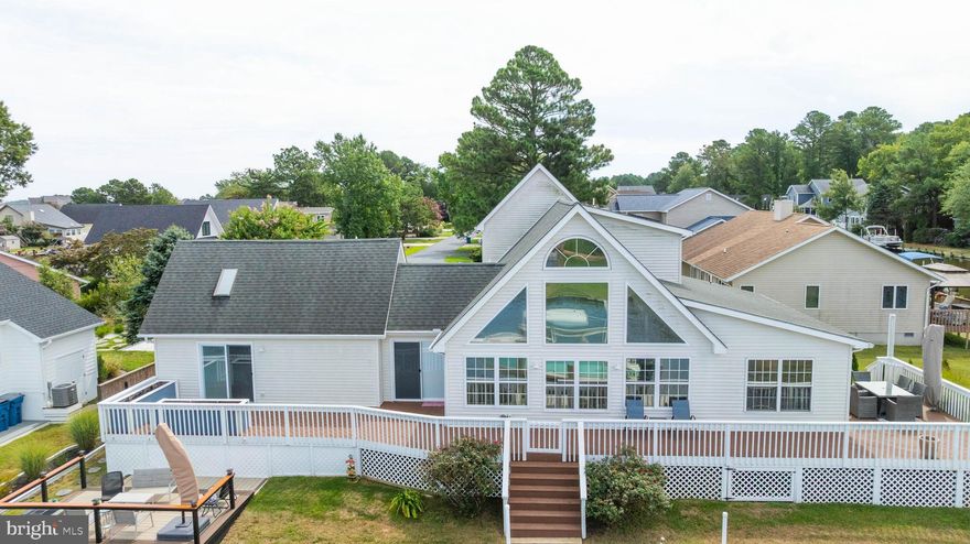 New price!   
Experience waterfront living at its finest in this beautifully maintained coastal-style home, perfectly situated along a bulkheaded canal with serene water views. This 3-bedroom, 2.5-bath retreat features a sought-after main-floor owner’s suite and a recently renovated kitchen with stylish finishes, ideal for both everyday living and entertaining. Floor to ceiling windows in the living room to enjoy the peaceful water view. 
Enjoy seamless indoor-outdoor living with a spacious wraparound deck—perfect for relaxing, dining, or taking in the tranquil canal setting. A true blend of comfort and coastal charm, this home is ready for your next chapter on the water.