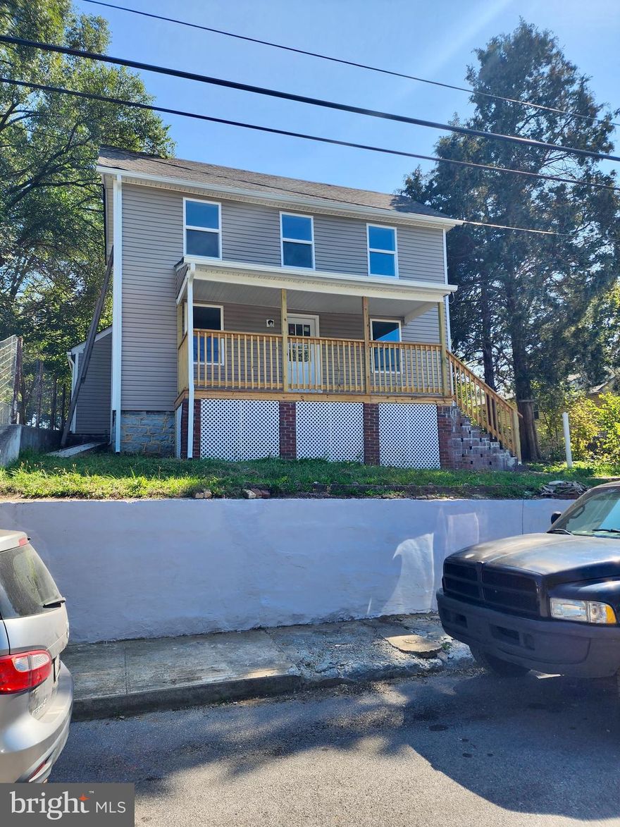 Fully updated inside AND out, this fantastic home in the heart of Downtown Martinsburg could be the one you've been searching for! On the main living level, you'll find the foyer, living room, kitchen with stainless steel appliances and laundry area, mud room, and Primary Bedroom and full bathroom. Upstairs are 2 additional bedrooms as well as a 2nd full bathroom. Gorgeous and durable laminate wood floors give the home a warm and welcoming feel. There is an unfinished basement area as well as a floored attic that is ideal for storage. Outside, you'll love relaxing on your front porch or spending time in the tree-lined backyard that truly feels like an oasis. Brand new floors, appliances, paint, HVAC, roof, siding and more! Walking distance from the MARC train as well as many downtown amenities, walking trail, and parks. Don't let this charmer slip through your fingers...schedule your showing TODAY!!