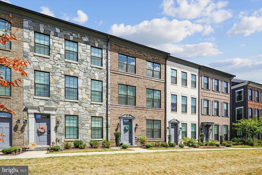 Welcome to this stunning & impeccable 3 year YOUNG luxurious  townhome! This home shows like a model with amenities and upgrades galore, including 7 1/2" wood plank floors, quartz countertops in the kitchen and all bathrooms, a custom stone fireplace, wood accent panel in the dining room, wood staircases throughout, and 5 custom ceiling fans are spread out throughout the home.  This home is beautifully and masterfully laid out to provide an "experience" of the finest living space around.  Offering 2,239 finished square feet including  4 finished levels with a private and stunning rooftop terrace for your morning coffee, watching the sunrise or entertaining.  Move-in ready, this home boasts 3 bedrooms, 3 full baths and 2 half baths with all bedrooms being ensuite for privacy.  The gourmet chef's kitchen with it's quartz countertops, upgraded cabinetry, tons of counter space, upgraded stainless steel appliances, and enormous quartz island with breakfast bar provides a great hang out spot for guests or those special nights of cooking in. The primary bedroom boasts a spa-like primary bath including a quartz double vanity and oversize walk-in shower w/floor to ceiling custom tile.  The 2-car garage boasts lots of space for storage, including  the E-Z Glide Tote Slide for out-of-the-way ceiling storage. HOA offers a a playground, a dog  park, a putting green, a jog/walk path,  a fire pit and outdoor grills.  This community has everything including a convenient location to shopping, schools and entertainment to include Fairfax Towne Center, Fair Lakes Shopping, Fair Oaks Mall, and Fairfax Corner.  And, just mere miles from Fairfax County Parkway, I66, Rt 50, Lee Highway and only 20 minutes from Dulles Airport.  This home is a must see!!