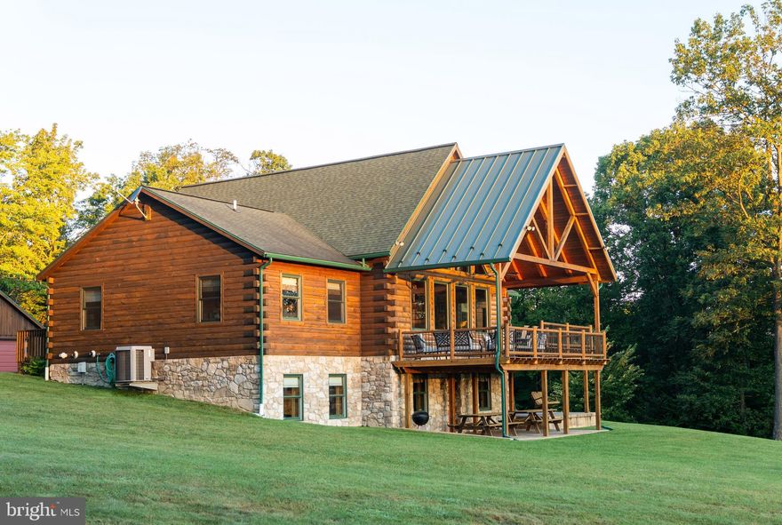 This 226+/- acre property in Pennsylvania offers a combination of a custom timber-frame home, diverse recreational land, and an income-producing opportunity through short-term rental use. With wooded ridges, mountain views, and direct access to state forest, it functions as both a sportsman’s retreat and an investment property.

The land is largely wooded and contains a developed trail system suitable for ATV or UTV riding, horseback use, or hiking. Three established food plots are planted in mixed blends that attract whitetail deer, black bear, and wild turkey. Little Valley Creek flows through the tract and is a highly desirable trout stream known to hold brown trout. To the west and south, the property borders the Tuscarora State Forest, creating direct access to thousands of acres of additional ground.

At its center stands a custom timber-frame home built in 2009, offering more than 4,600 square feet of living space with seven bedrooms and three bathrooms. The home includes vaulted ceilings with exposed beams, hardwood floors, and a custom kitchen with a large dining area. Large windows capture the mountain views, which can be enjoyed inside or outside on the covered deck and stamped-concrete patio below. Additional features include a lower-level game room, dual tankless water heaters, PEX plumbing, and a detached garage with loft storage.

For hunting use, three Redneck blinds are in place and overlook the food plots. The property is enrolled in Pennsylvania’s Clean & Green program, lowering annual taxes.

For investors, the lodge has been evaluated for short-term rental use. Market data indicates projected annual revenue of approximately $163,000 with average daily rates around $916, supporting net operating income estimates of more than $100,000 after operating expenses.

The seven-bedroom layout, location, and nearby outdoor recreation position the property competitively among other large rural rental lodges in the region.

Despite its secluded setting, the property remains accessible. It is approximately 40 miles from Harrisburg, 45 miles from Carlisle, 90 miles from State College, and about 120 miles from Philadelphia.

This listing presents a unique opportunity to own a large timber-frame lodge property with recreational land, trout stream frontage, and both personal and investment appeal.

Oil, gas and mineral rights convey with the sale. Access to the property is through the Pennsylvania State Game Lands Parking Lot. Entrance is gated. Showings require a Pennsylvania Licensed Real Estate Agent.