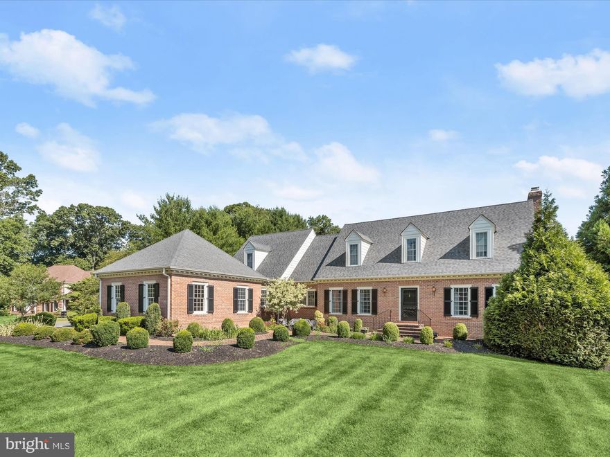 Discover unparalleled elegance in this breathtaking brick colonial estate, nestled on over 2 acres of meticulously manicured grounds in the prestigious Wellington area of Glenwood. Perfectly designed for luxurious living and grand entertaining, this home features a charming patio with stunning views of the expansive, landscaped gardens.  Step inside through the three-car garage or the grand front entrance and be welcomed by a sophisticated foyer showcasing chair railings, a dramatic vaulted two-story ceiling, and gleaming hardwood floors that flow seamlessly throughout the residence.  The formal living room exudes grandeur with its high ceilings, one of three architecturally detailed fireplaces, an exquisite mantle, and double crown molding. Adjacent to the formal living room is the dining room, ideal for hosting lavish gatherings or intimate dinners, adorned with chair railings, crown molding, and direct access to the gourmet kitchen.  Culinary enthusiasts will adore the kitchen, which boasts an expansive center island, premium 36-inch cabinetry, top-of-the-line stainless steel appliances, a wet bar, a charming garden window, and luxurious granite countertops. The adjoining breakfast area opens to the family room, where plantation shutters and custom built-in bookcases flank the second fireplace, creating a cozy yet refined ambiance.  The sunroom, accessible from the sitting room, is a sanctuary of natural light, featuring large windows, elegant ceramic tile flooring, and stylish fixtures. The primary bedroom suite offers a retreat-like experience with multiple walk-in closets, a private sitting room, and a lavish en suite bathroom equipped with dual vanities, a spacious soaking tub, and a walk-in shower.  Above the garage, an additional suite includes a bedroom, a living room, and a full bath, perfect for guests or an au pair. The upper-level houses two more bedrooms with private baths and plush carpeting, offering serene personal spaces.  The versatile lower level includes a sophisticated wine room, a powder room, and expansive recreation and game areas centered around the third fireplace, with seamless access to the picturesque rear yard. Conveniently located near major commuter routes MD-29, MD-32, and I-70, this estate ensures easy travel to numerous points of interest.  Experience the epitome of luxury living in this exceptional Glenwood estate, where every detail is perfectly crafted.