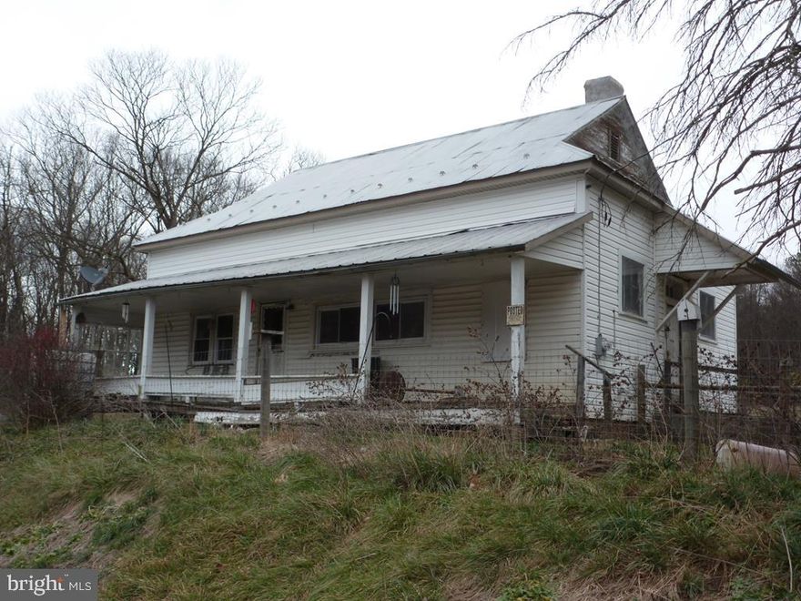 Drive a little to invest in this "Diamond" in the rough. Nice 2 acre total meadow offers what used to be an old school house. Home being sold "AS-IS". Bath has no functioning appliances at time of listing. Nice fenced level meadow. Covered front porch. All wood floors need restored. Steps to access the attic area are beside the new 2021 oil furnace. Consider tearing the home down to place a modular or mobile in it's place! Improved lot w/ well and septic. Home is extremely dirty, wear masks. Cash or conventional only.