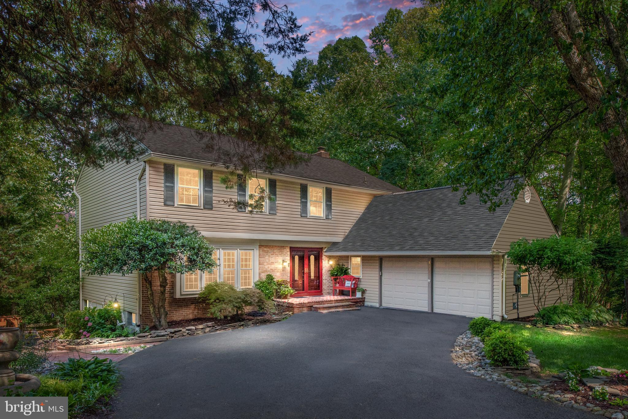 Space, Privacy & Convenience in the Heart of Springfield. Situated at the end of a quiet cul-de-sac, this is the largest home in the neighborhood with 5 bedrooms and 4 bathrooms, offering exceptional privacy while being just minutes from the Metro, I-95, I-395, and I-495—perfect for commuting to the Pentagon, Fort Belvoir, or Washington, DC. This premier location is also surrounded by parks, nature trails, and top-rated schools. Step through the elegant double front doors into a gracious foyer featuring a stunning curved staircase. The main level boasts beautiful hardwood flooring throughout and includes a spacious formal living room, separate dining room with crown molding, a family room with a fireplace opens to an updated kitchen This beautifully appointed kitchen offers the perfect blend of traditional charm and modern functionality. Featuring rich cherry cabinetry with detailed crown molding, granite countertops, and a custom tile backsplash, the space exudes warmth and craftsmanship. Stainless steel appliances—including a smooth-top range, built-in microwave, and a new dishwasher and everyone's favourite, a greenhouse window over the sink to view the stunning back yard. This central window above the sink fills the room with natural light, while recessed lighting and a pendant fixture provide additional brightness. The expansive granite peninsula offers ample workspace and doubles as a breakfast bar—ideal for casual dining or entertaining. With abundant cabinetry and a thoughtful layout, this kitchen is as functional as it is stylish. Additionally there is a Main level bedroom or hobby room for a multitude of uses. A dining room, living room, large laundry room with ample storage and access to the oversized two-car garage complete the main level. Upstairs you’ll find brand-new carpet and generously sized bedrooms—all with ceiling fans. The expansive primary suite includes a Juliet balcony, dual walk-in closets, . Three additional bedrooms and an updated hall bathroom offer comfortable accommodations for family or guests. The finished walk-out lower level includes a large recreation room, a full wet bar with built-in beer tap, and ample space for entertaining, hobbies, or a home gym. Sliding doors to the large patio and access to the multiple tiered decks. The oversized two-car garage has upgraded SwissTrax flooring, a built-in storage loft, and pull-down attic stairs for extra storage. It’s functional, stylish, and built to impress. Outside is a complete oasis and you will not believe you are not in a park. Enjoy total tranquility in the stunning, private backyard that backs to protected parkland. A three-level deck with integrated lighting provides multiple outdoor living spaces, including a beautiful pergola retreat. This peaceful, tree-filled setting feels like your very own park—perfect for relaxing, entertaining, or enjoying nature. The home and grounds are exceptional and this is the first offering of this property. Lovingly maintained over the years, this home is in ready condition and is a great value! Listed lower than recent appraisal. Instant equity!