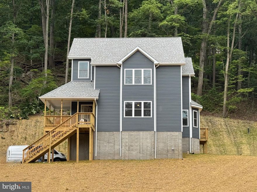 Incredible opportunity to buy a spacious brand new 4 BR home with deeded access to the Shenandoah River and several mountain lakes on 1+ acre parcel with woods and large front yard!  Construction is under way!  Set for completion in May.  Great commuter location - short drive back into the metro area. This attractive colonial has 4 bedrooms, 3 full bathrooms, and full walk-out basement, making this 3-level home a great investment in comparison to other listings on the market with less square footage.  By finishing the basement, this home could have  2500+ finished square feet of living space.  Part of the work for finishing the basement is already done, with rough-in plumbing for a 4th bathroom, and HVAC ductwork for heating/cooling already installed.    Front deck & veranda open to main living area with lots of windows to take in pleasant park-like setting of beautiful Shenandoah Farms.  Main level has one bedroom and full bathroom, spacious living room and gourmet kitchen with bay window and secondary entrance/side deck.   Upper level has 3 more bedrooms, with master suite that has full bathroom and walk-in closet.  Act quickly to PICK YOUR OWN FINISHES  with choices for flooring, granite tops, soft-close cabinetry and stainless steel appliances.  All of this in an epicenter for recreation!  Enjoy your own private access to the river, and several different lakes.  Or enjoy nearby Skyline Drive, Andy Guest State Park, Appalachian Trail and many other attractions.  Why buy someone else's house when you can make this your own from the start! PLEASE EXERCISE CAUTION WITH SHOWING - ACTIVE CONSTRUCTION SITE. Agent/Owner
For directions to lot GPS address 125 Thompson Mill Rd, Front Royal.   For directions to lot GPS address 125 Thompson Mill Rd, Front Royal.  Property is on your left after 125 Thompson Mill Rd (Rt 50 to Howellsville Rd,  Left on Manor Rd, Left on Old Oak Lane, Right on Thompson Mill - property on left)