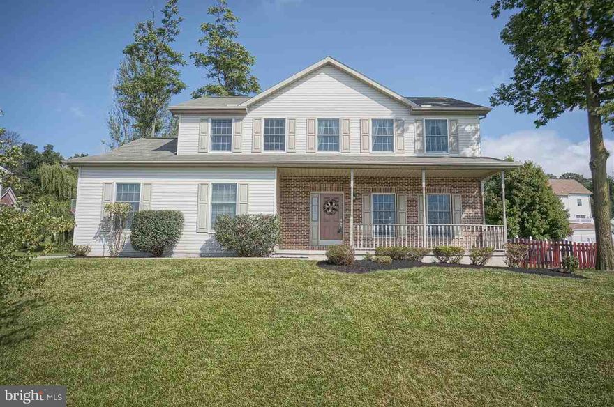 Beautiful bamboo floors in LR, DR & kitchen welcome you to this home w/9 ft ceilings on the main level. Kitchen w/quartz counter tops and island opens to the family room w/new carpet. Sliding glass doors lead you to the deck and a view of the level, fenced in back yard. 4 bedrooms upstairs with plenty of closet space, 2 full baths, and don't forget to check out the view! 2 car side entry garage and south facing paved driveway.  Full basement with lots of storage space. Newer heat pump! Come see this beautiful, well maintained home!
